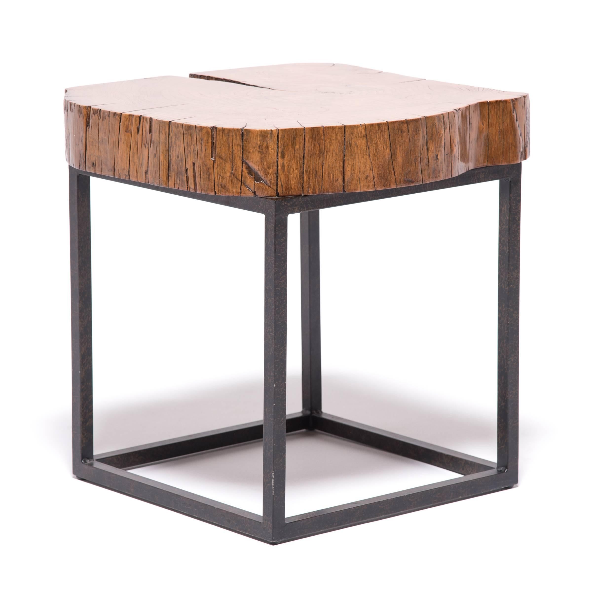 This smart, contemporary table was made in Canton, China. It has a reclaimed elmwood top: a favorite for Ming and Qing dynasty Chinese furniture-makers. The raw, natural edges of the wood contrast beautifully with the hard lines of the contemporary