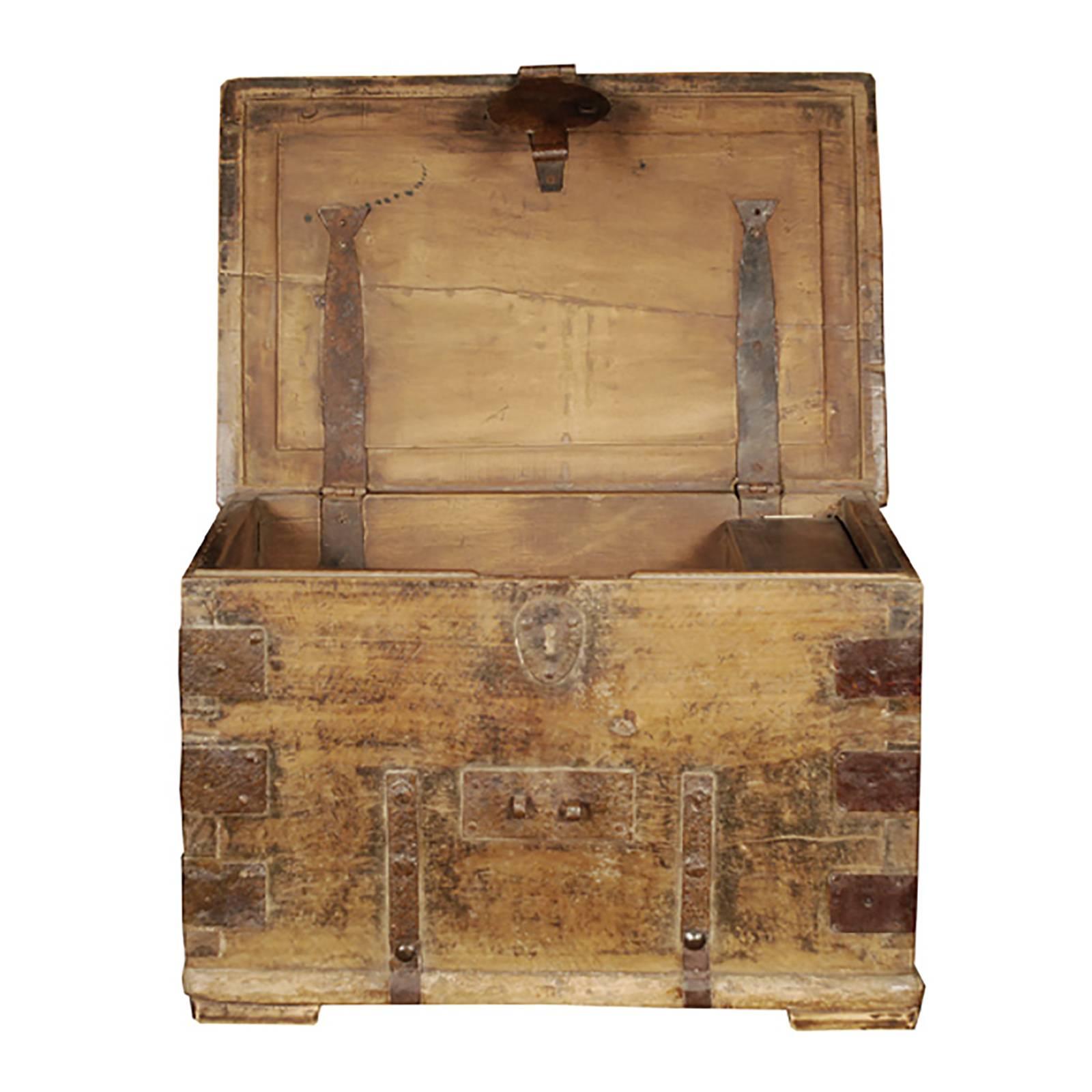 This wonderfully textured early 19th century keeper's chest is from Shanxi Province, China. The original hand-forged iron hardware was designed exclusively for function, but we love the way it beautifully punctuates the simple form of the footed