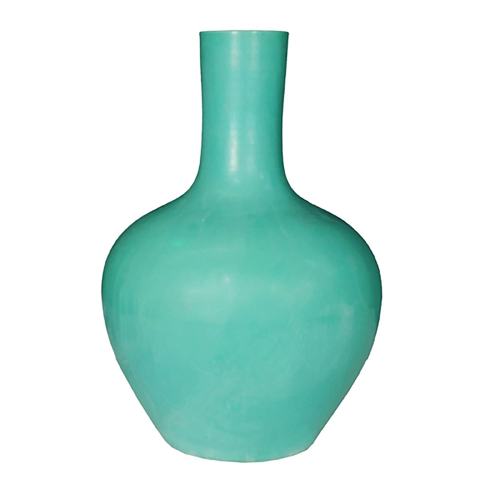 The shape of this contemporary vase is referred to as gooseneck. It was hand made in Southern China with a rich jade colored glaze according to ancient techniques rooted in the Song dynasty (960 to 1279), when the art of monochrome porcelains was
