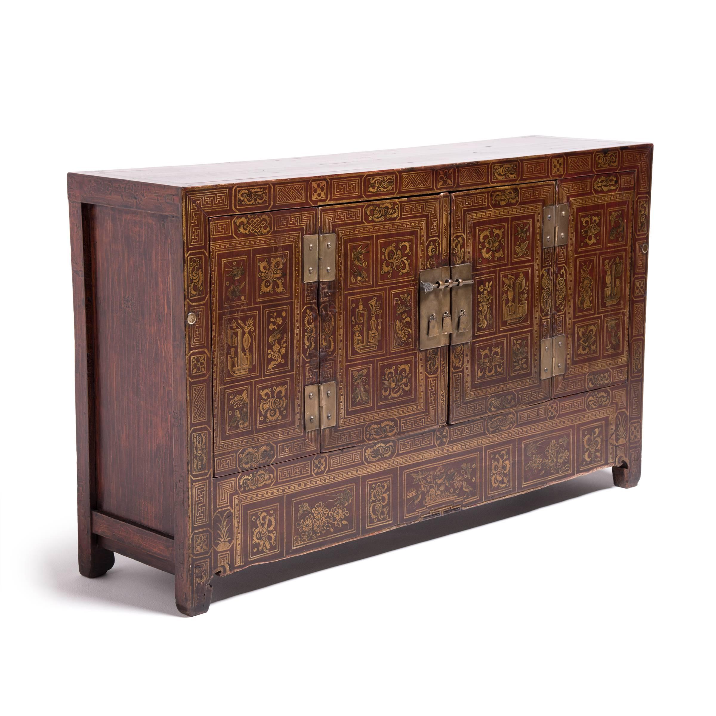 Rarely do you see a painted cabinet of this vintage in such flawless condition. This extraordinary cabinet is beautifully painted with images of auspicious birds, butterflies as well as books, scrolls and other treasures found in a scholar’s studio.