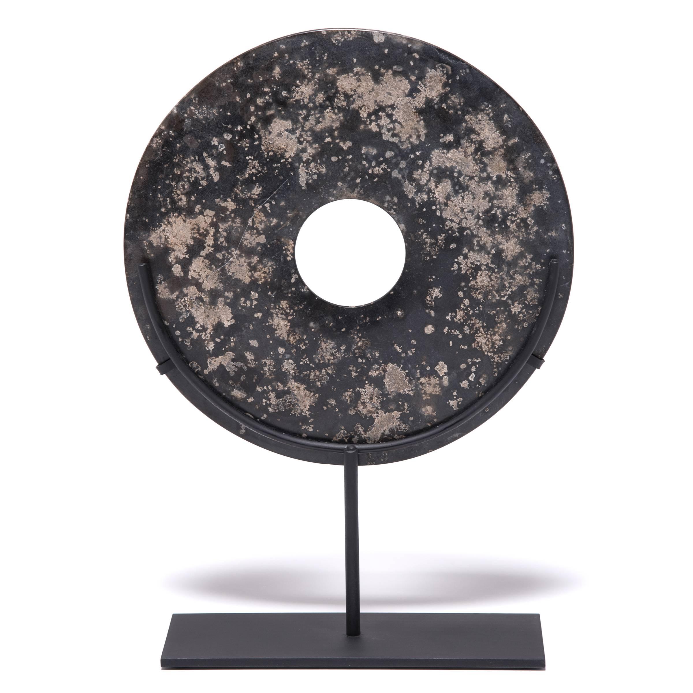 Jades have been cherished for thousands of years, with their rich heritage, beauty, and rarity. Jade Bi discs, similar to this contemporary example, have been found in the tombs of ancient Chinese emperors and aristocrats, but no one knows their