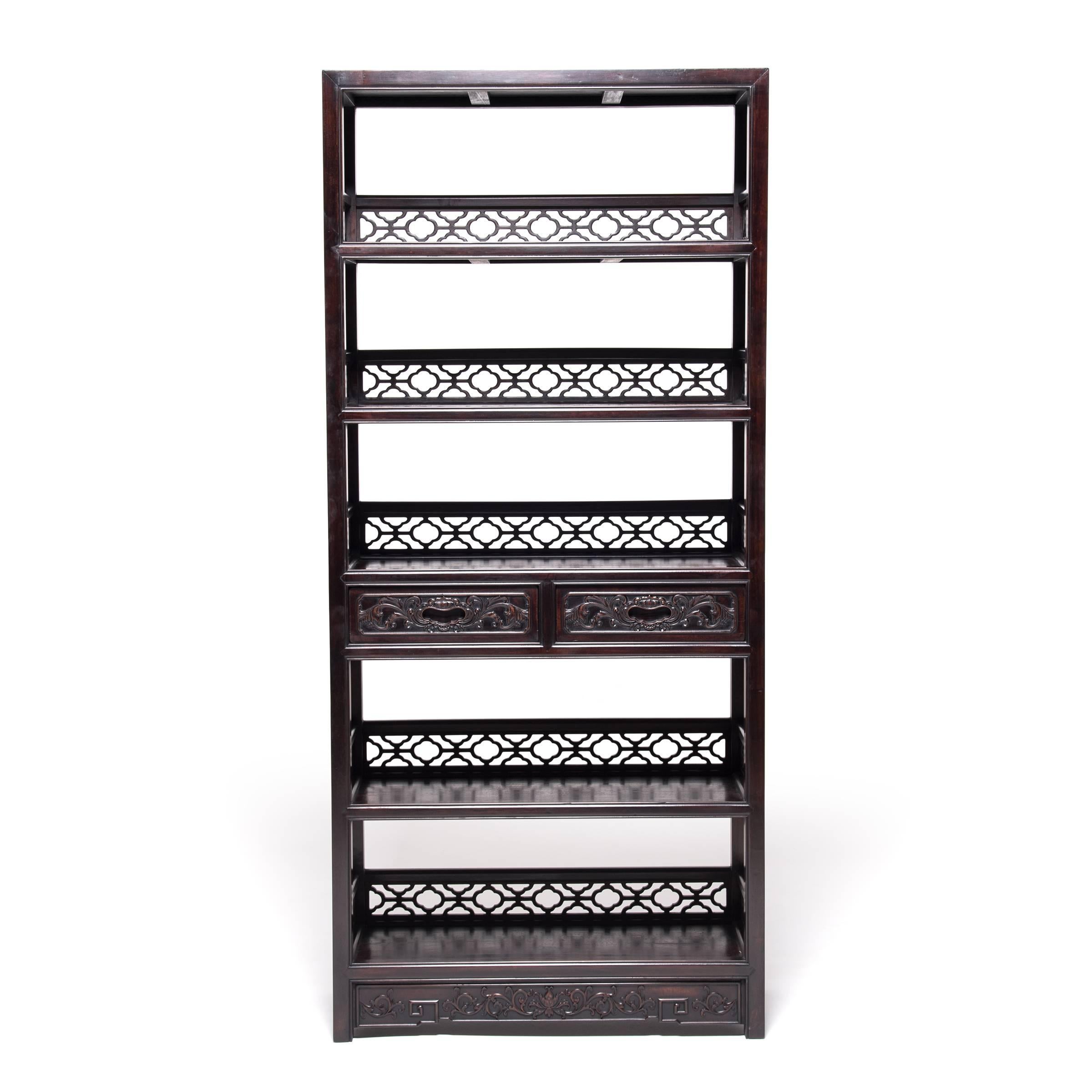 Collecting was a popular pastime for well-to-do Ming and Qing dynasty gentleman, and shelves like these would have been ideal places to display jades, curios, collectibles, and important texts. Each shelf is backed with lattice, brilliantly joined