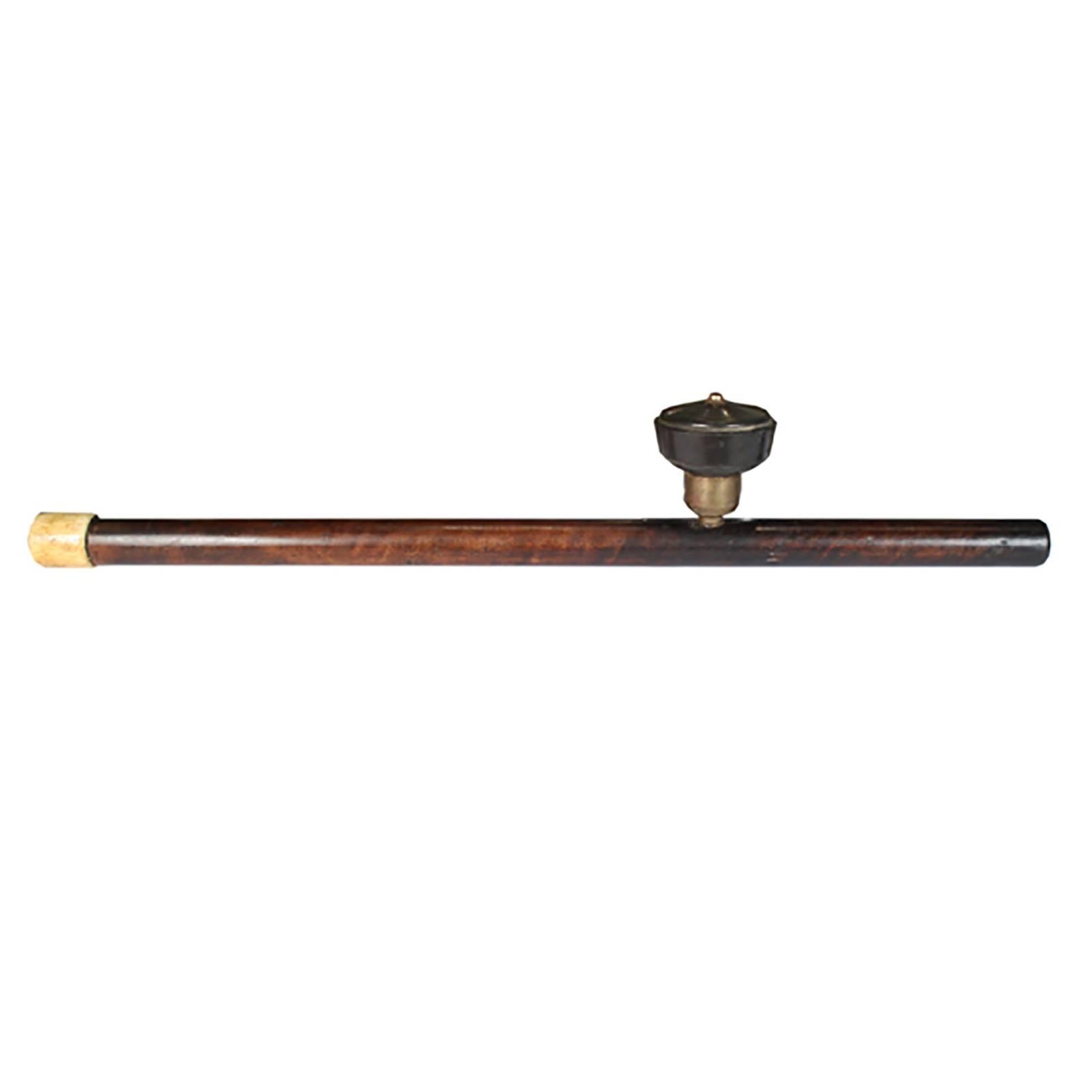 This handcrafted opium pipe is simple, elegant and finished in bone. It rests on a custom-made stand. Chinese culture had a longstanding love affair with all things opium beginning in the 8th century, when people began to use it as the cure for many