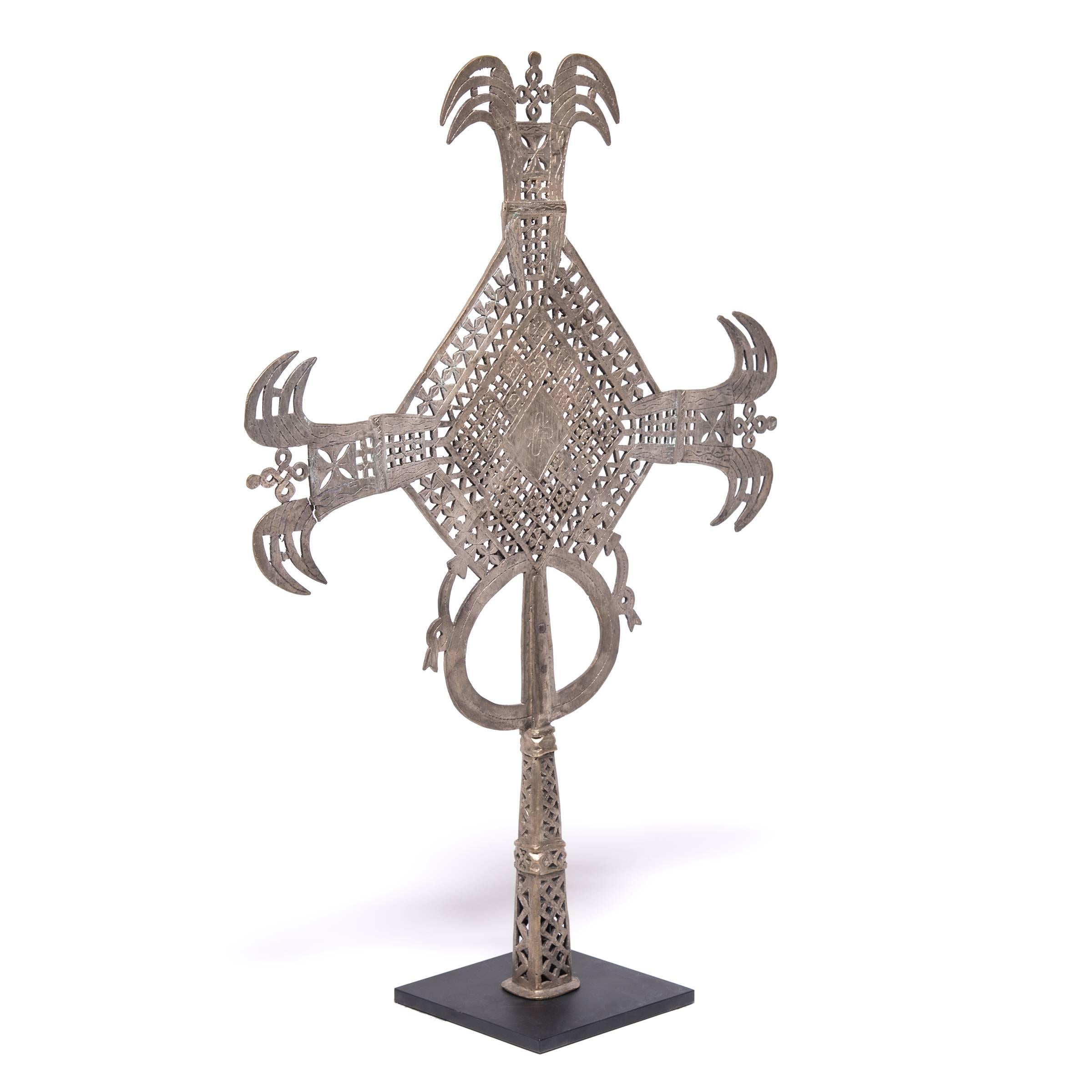 Ethiopia has been a Christian nation since the 4th century. The unique cross style of the region is specific to the Coptic subset of the Christian faith. The hollowed base could be either fitted over a staff for processionals or displayed at an