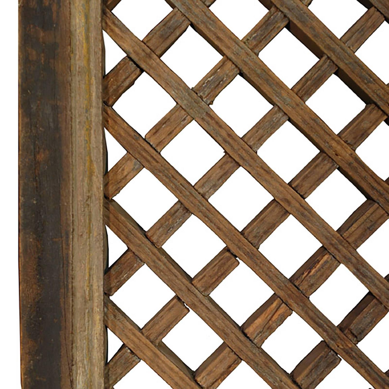 Elegant in its simplicity this 19th-century lattice window panel was designed to allow light and air in while providing a degree of privacy. Different from carving or perforating wood, the art of making a lattice was an exacting craft. Requiring