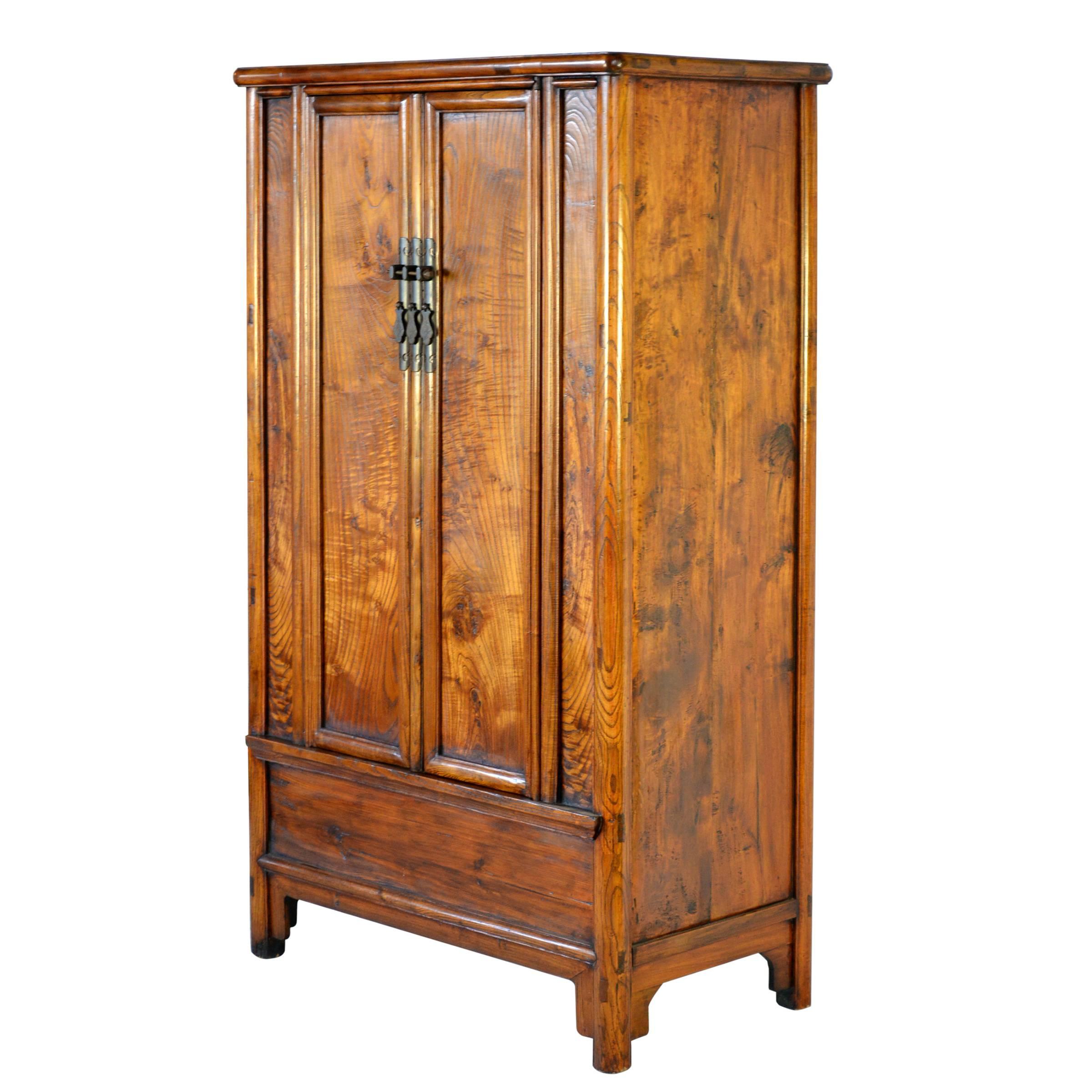 For nearly a thousand years, traditional Chinese architecture had no interior closets, so tall cabinets were the place to store books, clothing, antiques, food and everything else in a household. The doors of round-cornered cabinets, like this one,