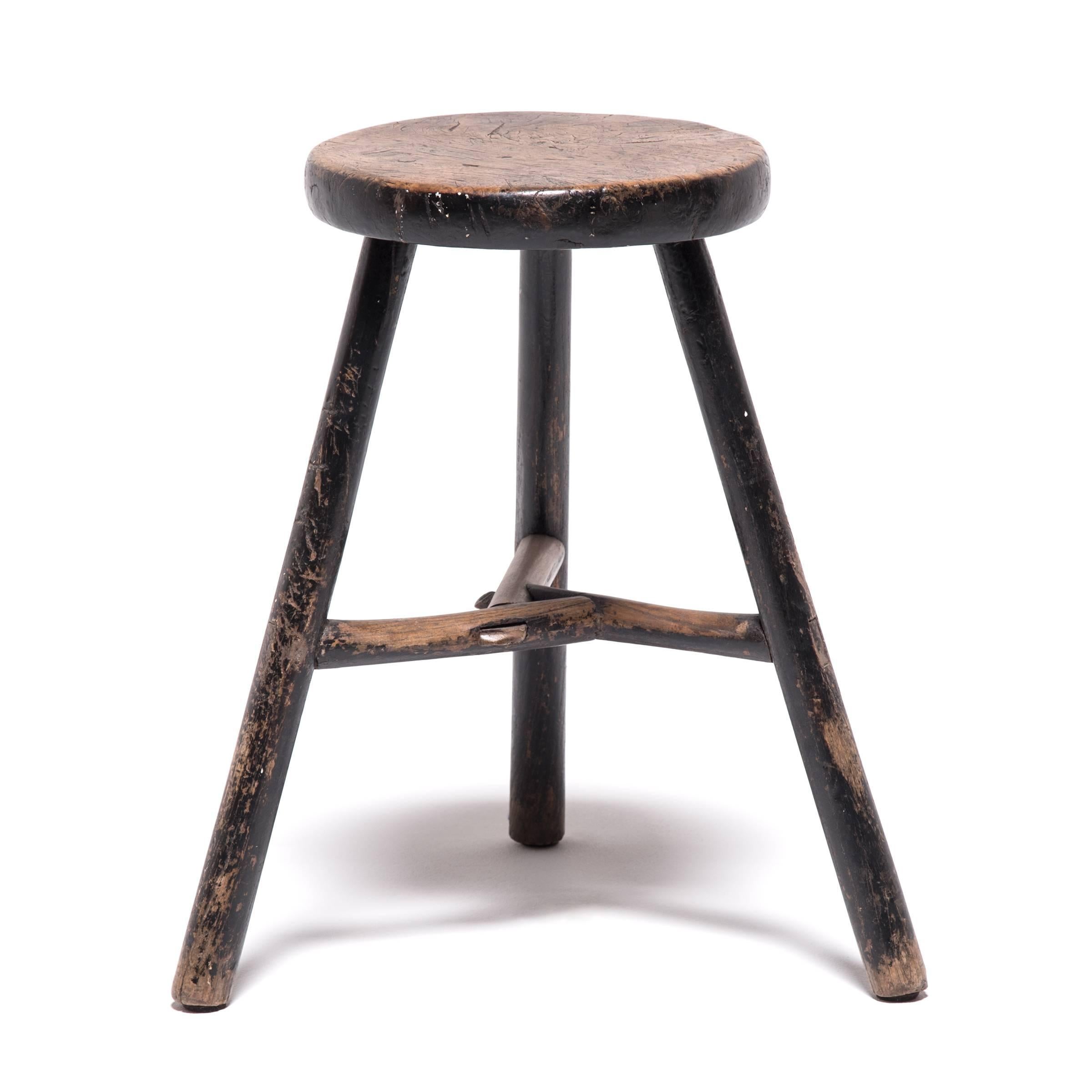 Deceptively simple, these rustic stools show off the ingenious construction techniques used by traditional Chinese woodworkers. Each stool’s three splayed legs are supported by stretcher bars that form a center triangle, a construction pattern that