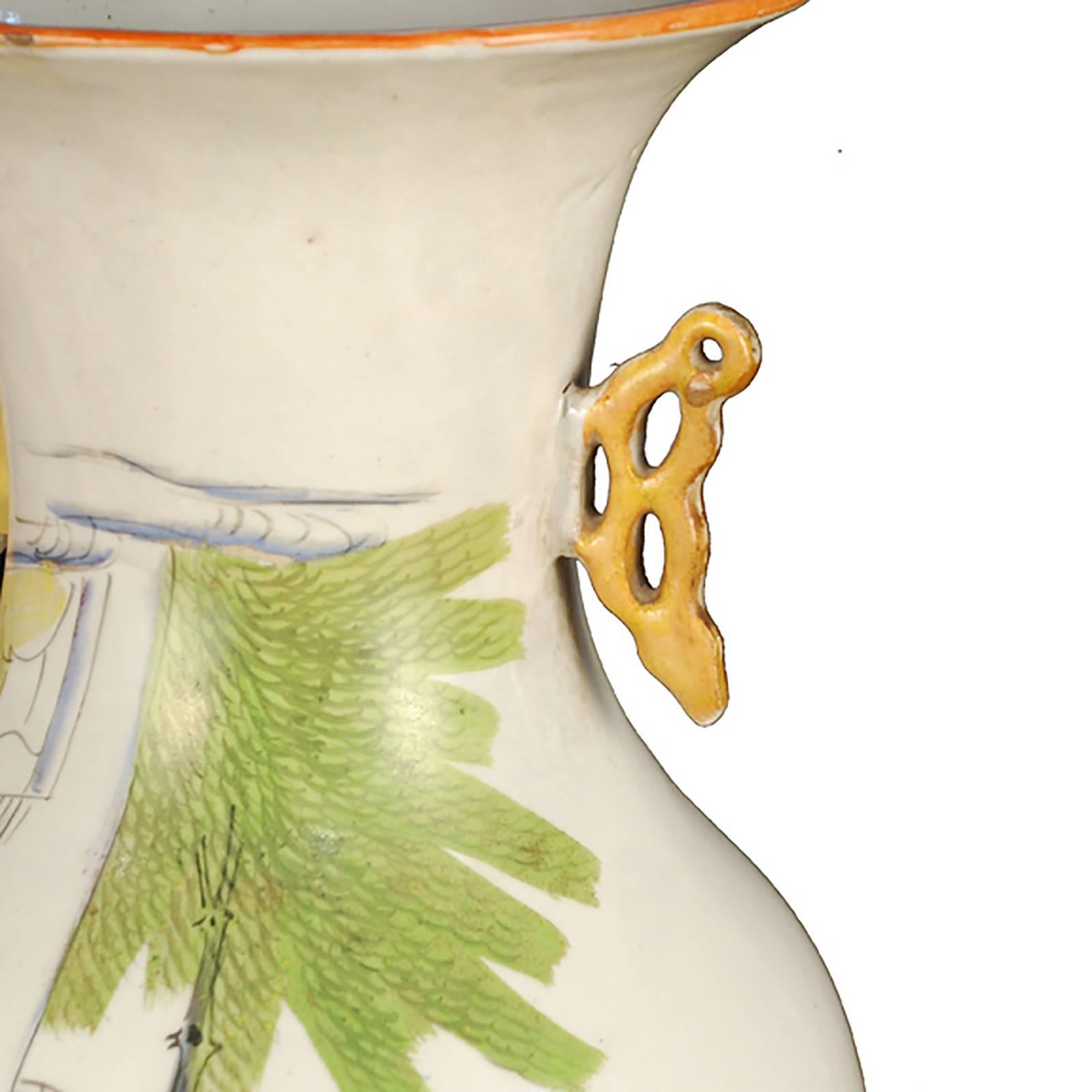 The form of this porcelain vase is called "phoenix tail" because of the way its flared mouth and slender waist mimic the shape of the bird. This shape gained popularity during the Qing dynasty. Its hand-painted vibrant landscape offers a