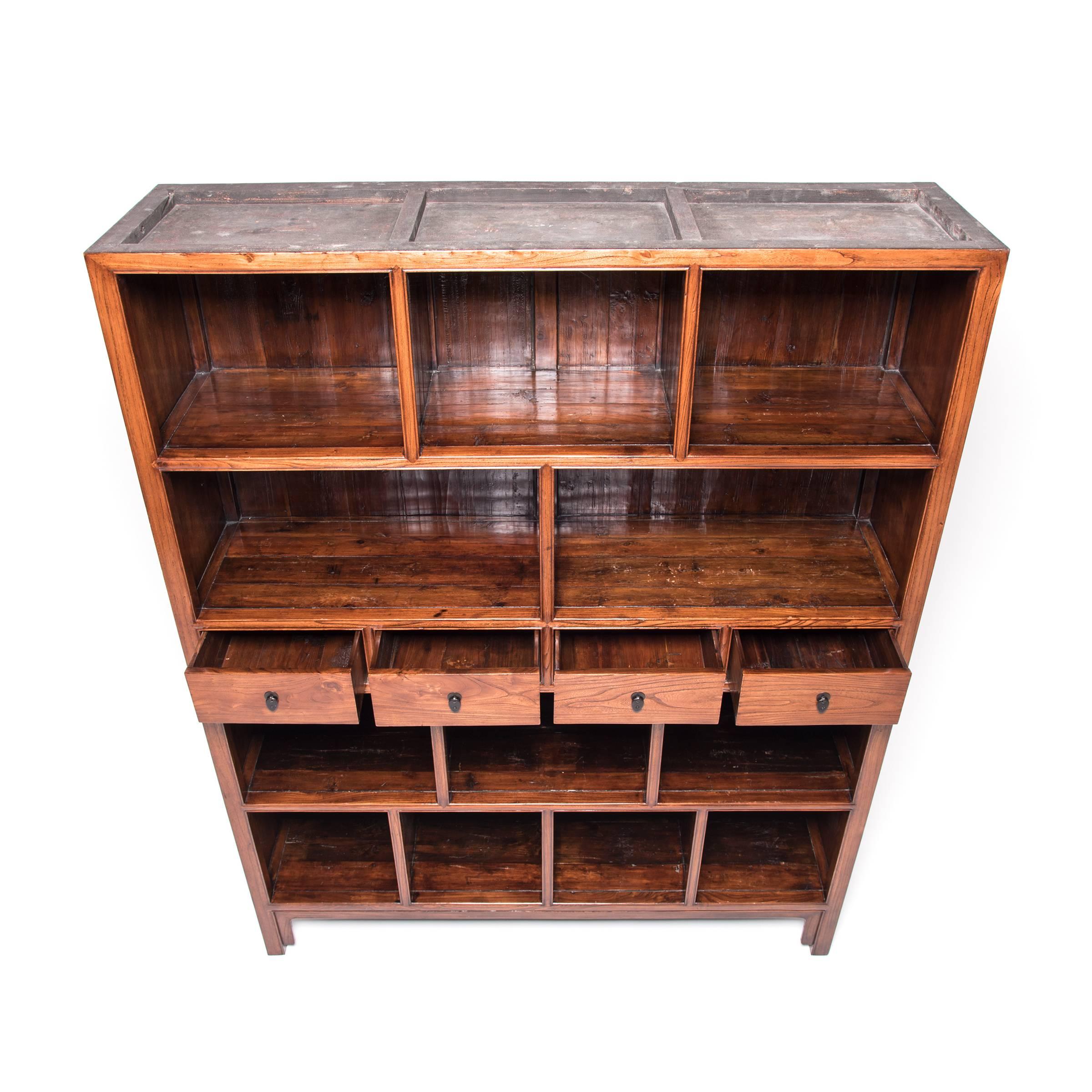 A quiet place for escaping mundane concerns, the scholar’s studio was carefully cultivated to promote intellectual and artistic thought. Likely the centerpiece of such a room, this handsome bookcase features open shelves ideal for storing and