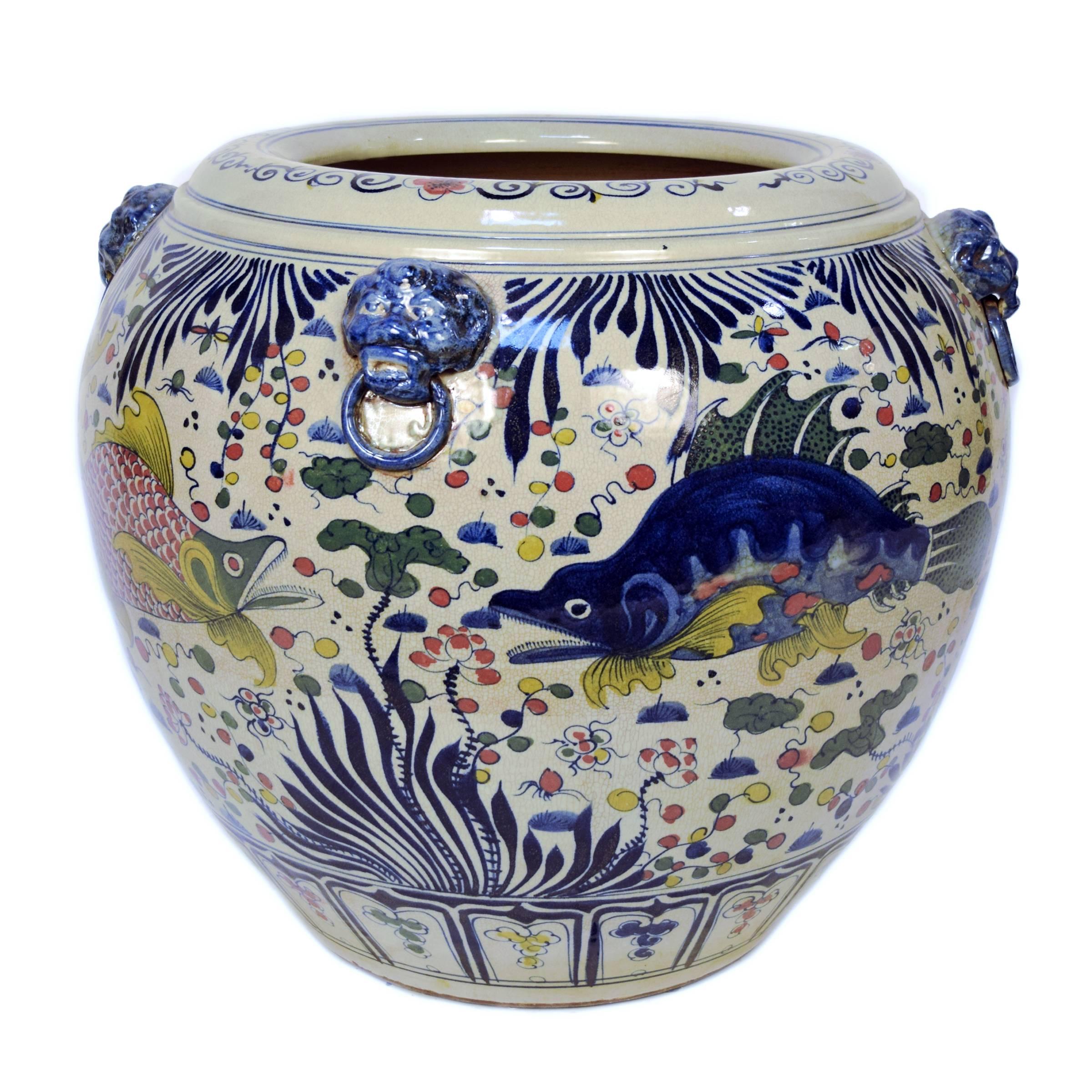 Traditional Chinese homes featured large ceramic fish ponds as both decoration and talisman of prosperity. The fish within combine with the aquatic motifs depicted on the exterior in 