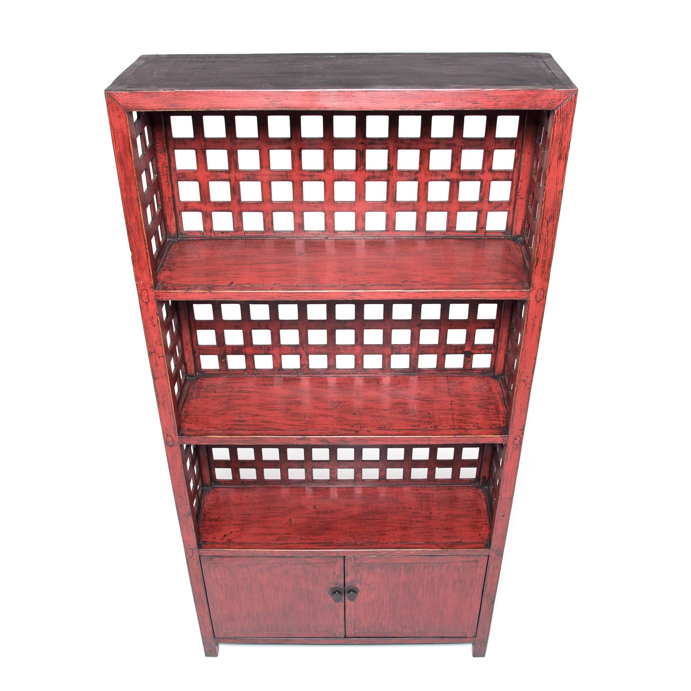 Inspired by the timeless design of Qing-dynasty furniture, our talented carpenters married a lattice window to a bookcase to stunning effect. The airy lattice back plays up on the hybrid’s mix of closed and open storage, while the red lacquer brings