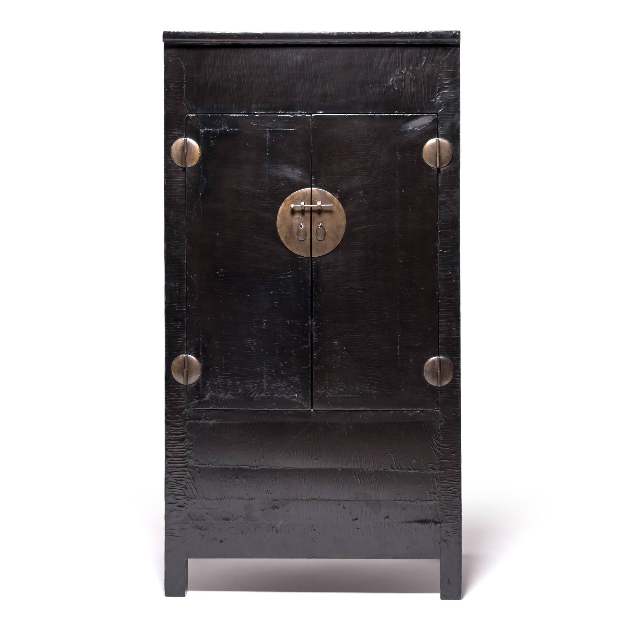 There are dozens of finishes that can imitate the look of crackled lacquer but nothing can compare to the real thing. After this stately cabinet was constructed, circa 1850, it was given layers upon layers of black lacquer, a time-consuming process