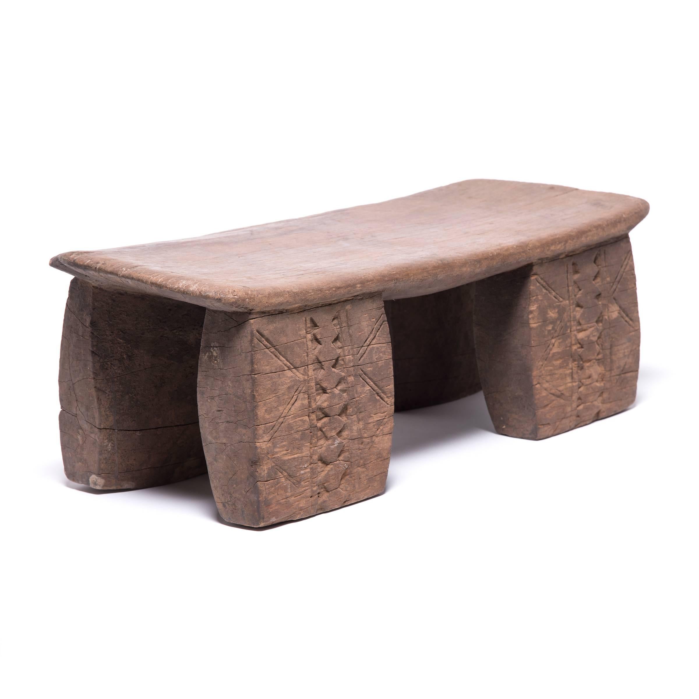 Hand-carved from a single, solid block of wood, each Senufo stool retains a unique personality as a modern sculpture, seat, or table. The irregular strokes and diminutive nature are telltale signs of this traditional woodcarving practice. In