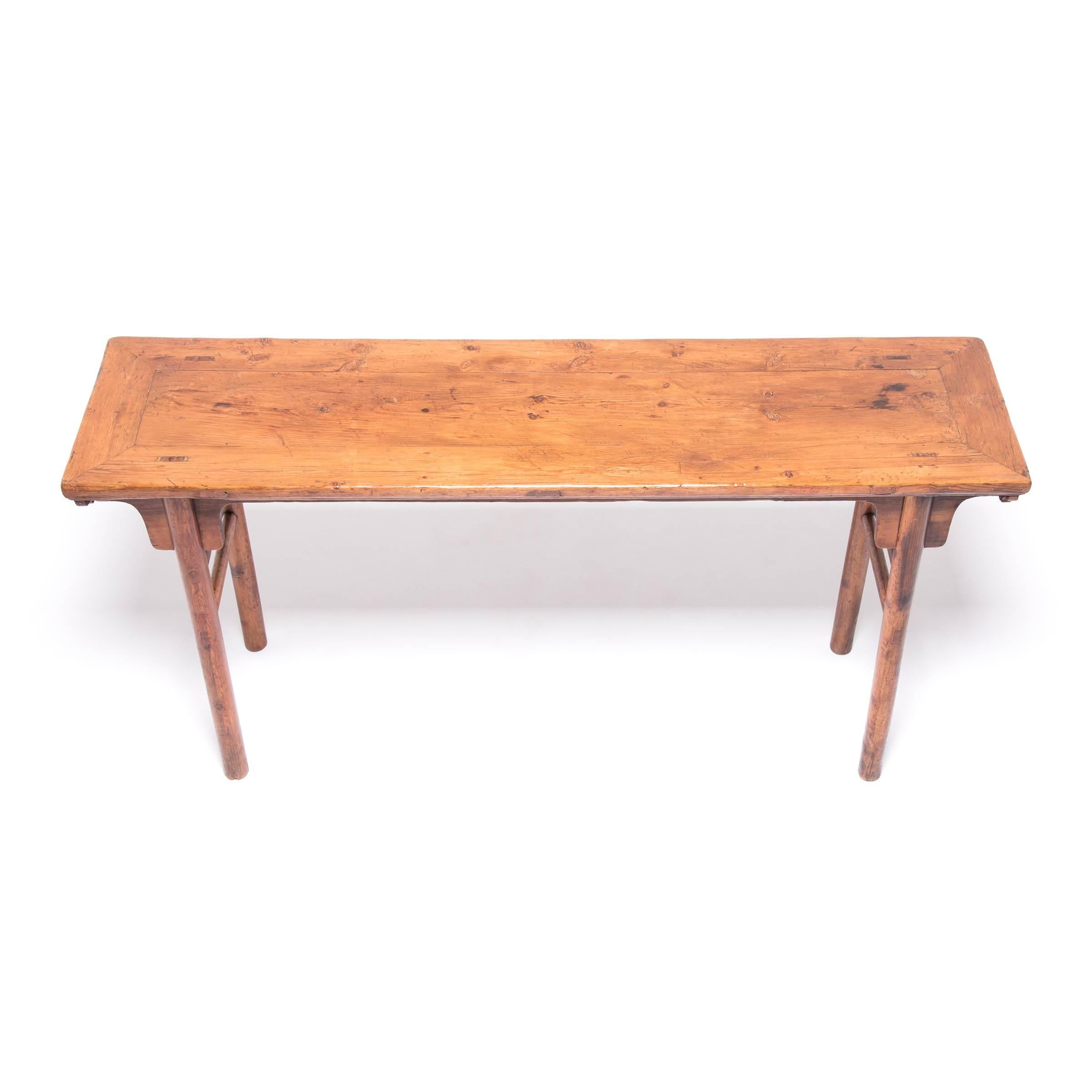 Over 150 years ago this splendid cypress wood table sat as the centerpiece in a family’s home in China's Shanxi Province. It probably served as their altar, the place where they paid respects to their revered ancestors. The elegant table is inspired