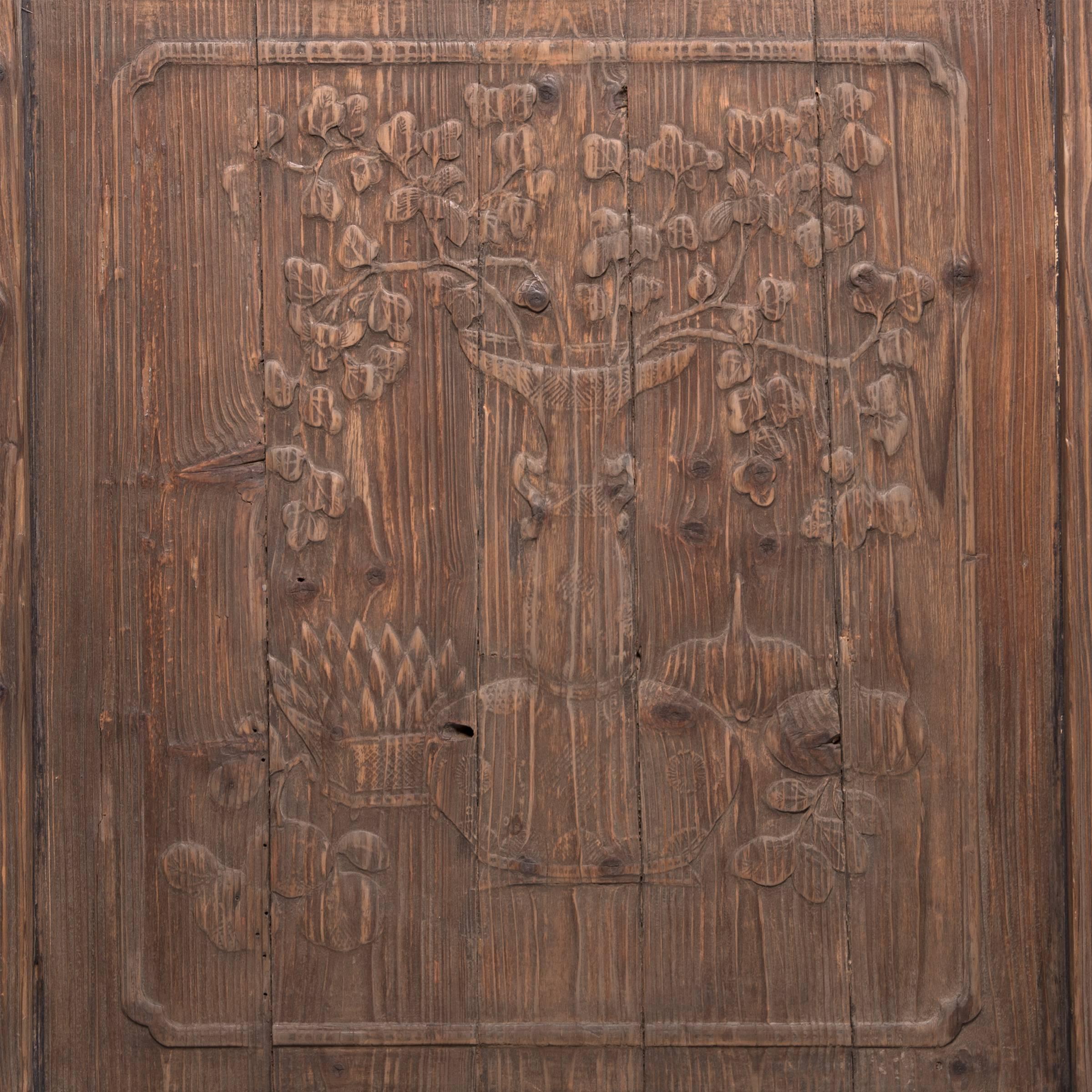 It’s difficult to pinpoint what makes this handcrafted panel so impressive: the artful relief carvings of seasonal fruit and lush, foliage-filled vases or the spruce wood’s prominent and expressive grain. Both are beautifully preserved in this