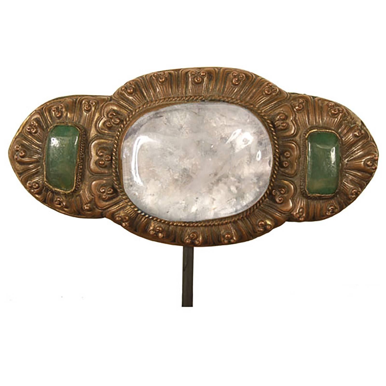 This 19th century Chinese belt buckle features an exceptional specimen of rock crystal flanked by two jade cabochons. The 19th century was an interesting period for fashion. Eastern and Western designers were influencing one another, and this buckle