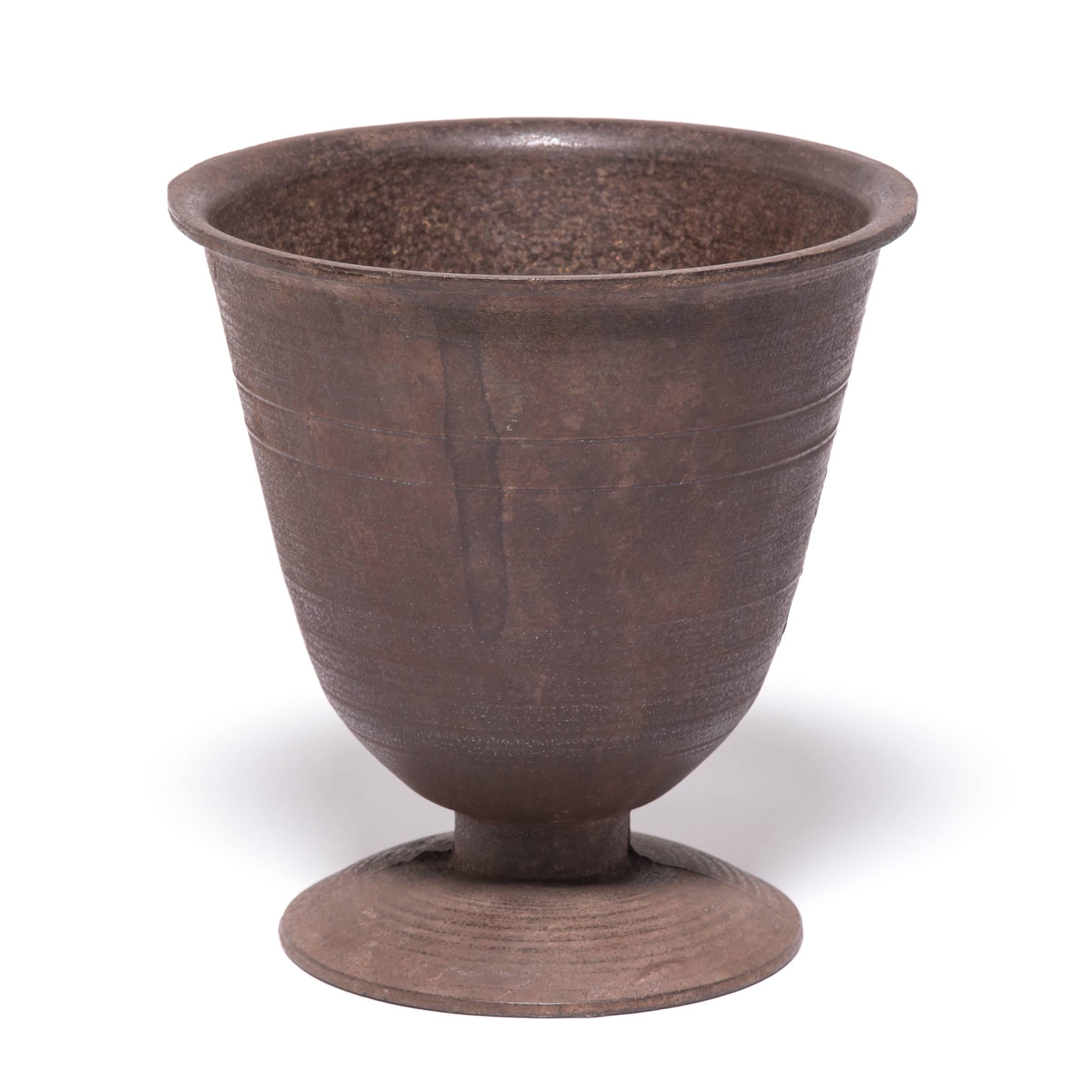 Since ancient times, apothecaries around the world have been using mortar and pestles like this one to grind medicinal herbs. This finely crafted and sculptural vessel was cast in iron in the early 1900s and would have been indispensable to a Korean