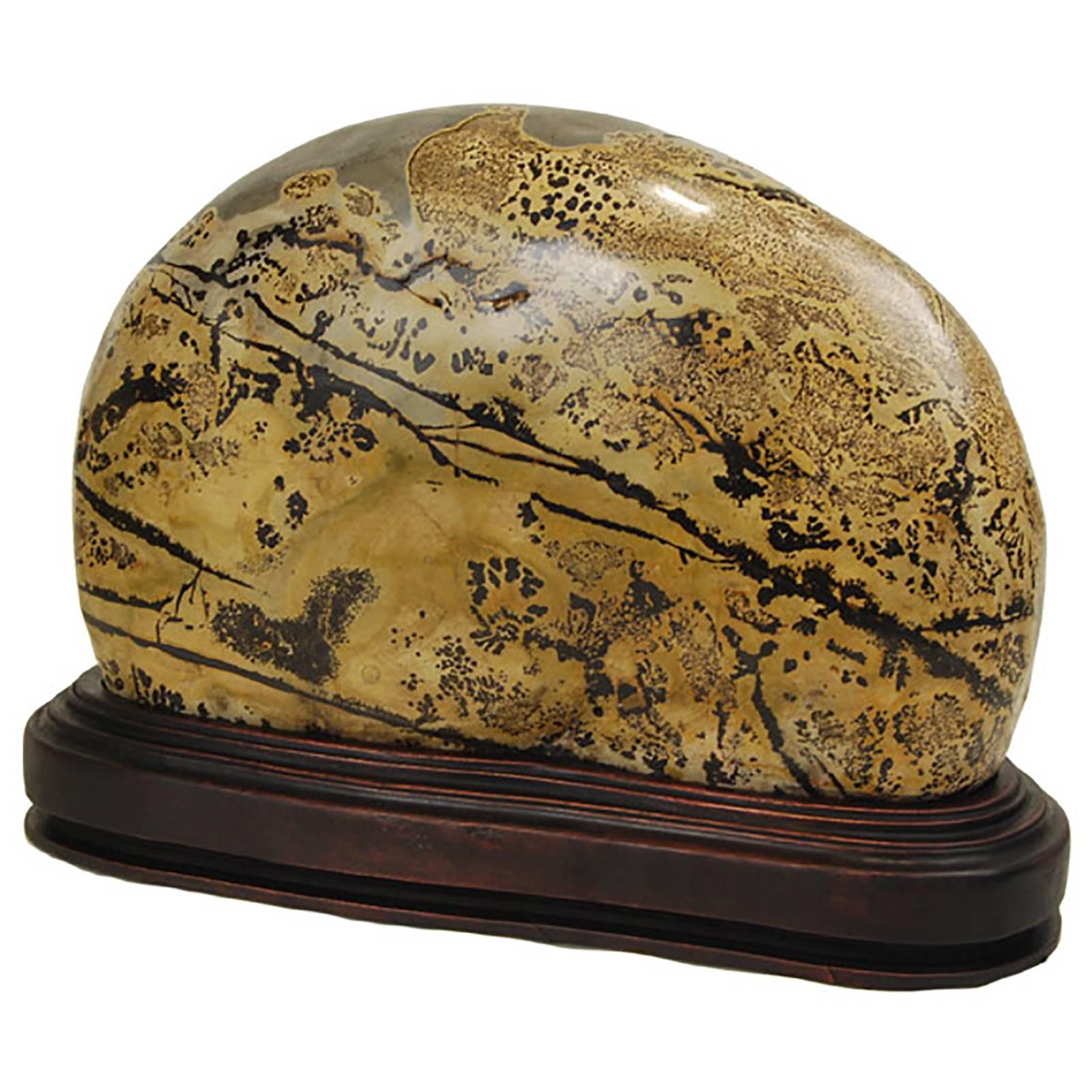 As if brushed with ink and inscribed with intricate calligraphy, this polished jasper stone is marked with dark swirls and intricate patterns. Unusual stones such as this one have been appreciated by Chinese painters, poets and calligraphers for