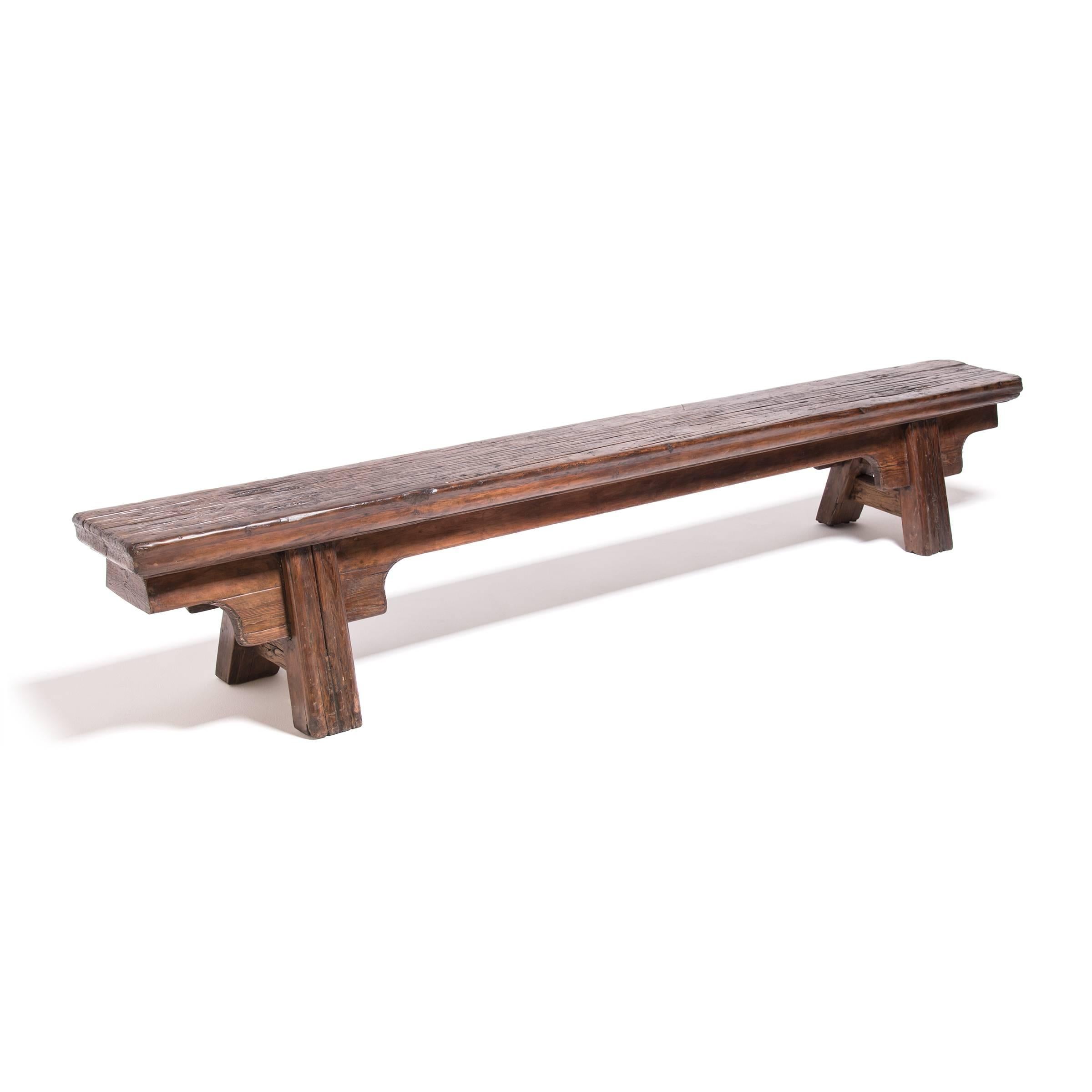 During the Qing dynasty, long benches such as this were used as shared seating and were often found in public spaces like temples, theaters, or courtyards. Crafted in China's Shanxi province over 150 years ago, this low bench has a timeless form