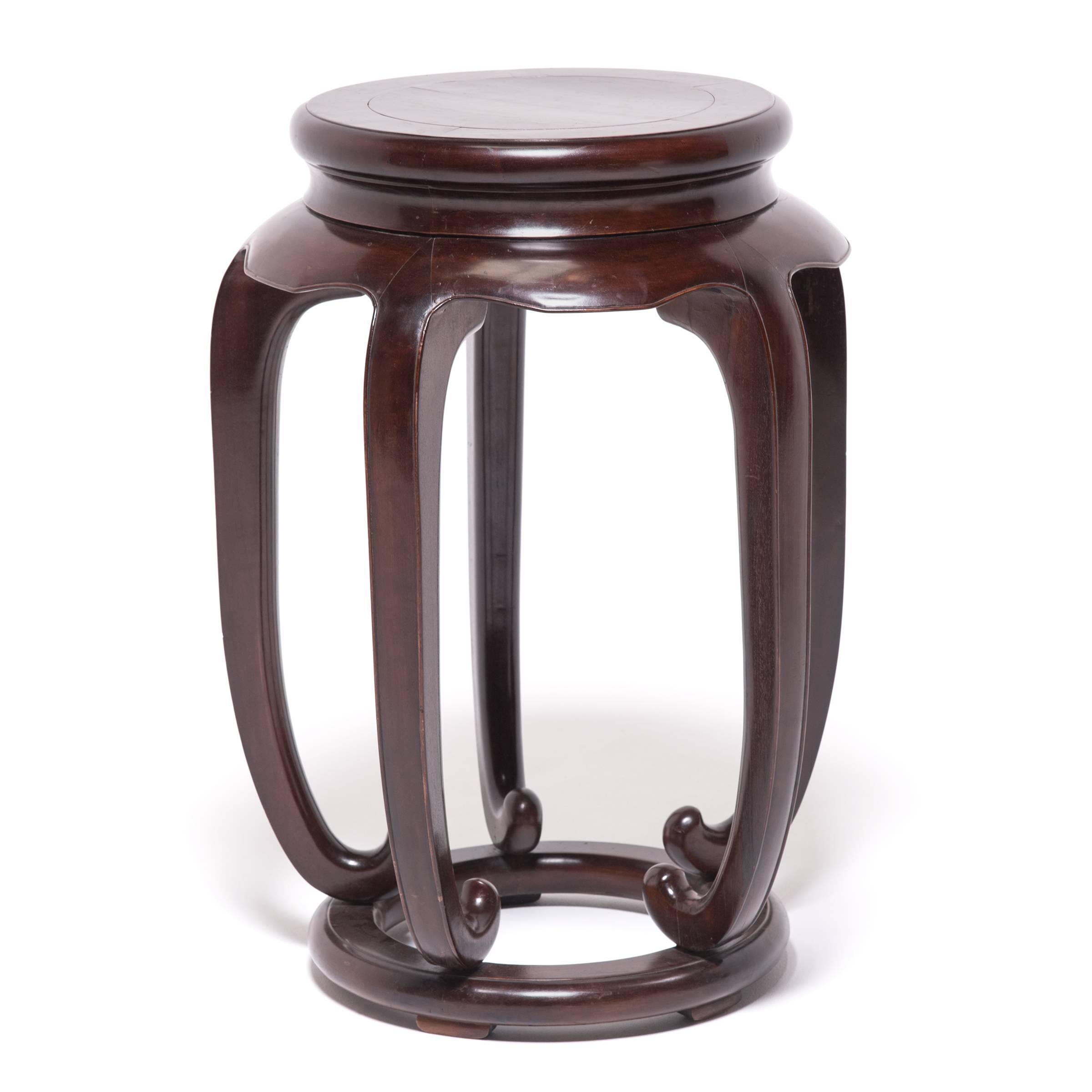 Rounded stands like this were frequently used in traditional Chinese culture as incense stands and are sometimes called meiping or vase stands because of their similarity in shape to a meiping jar. This jar was brilliantly built by hand with carved