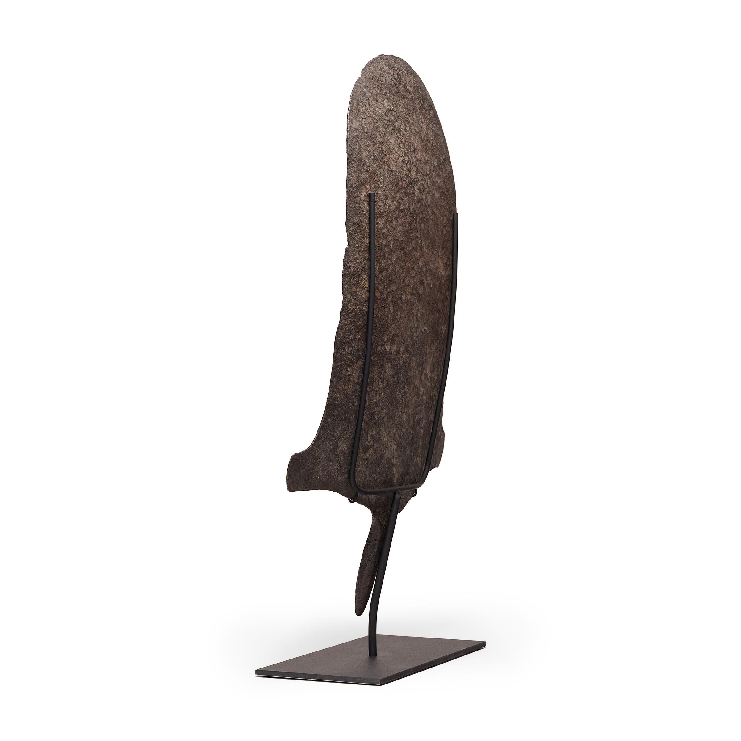 In many pre-colonial regions of Africa, iron was so valuable that tools often doubled as currencies for rare but significant transactions. This large iron form is a currency piece from the Afo peoples of northern Nigeria, and is modeled after the