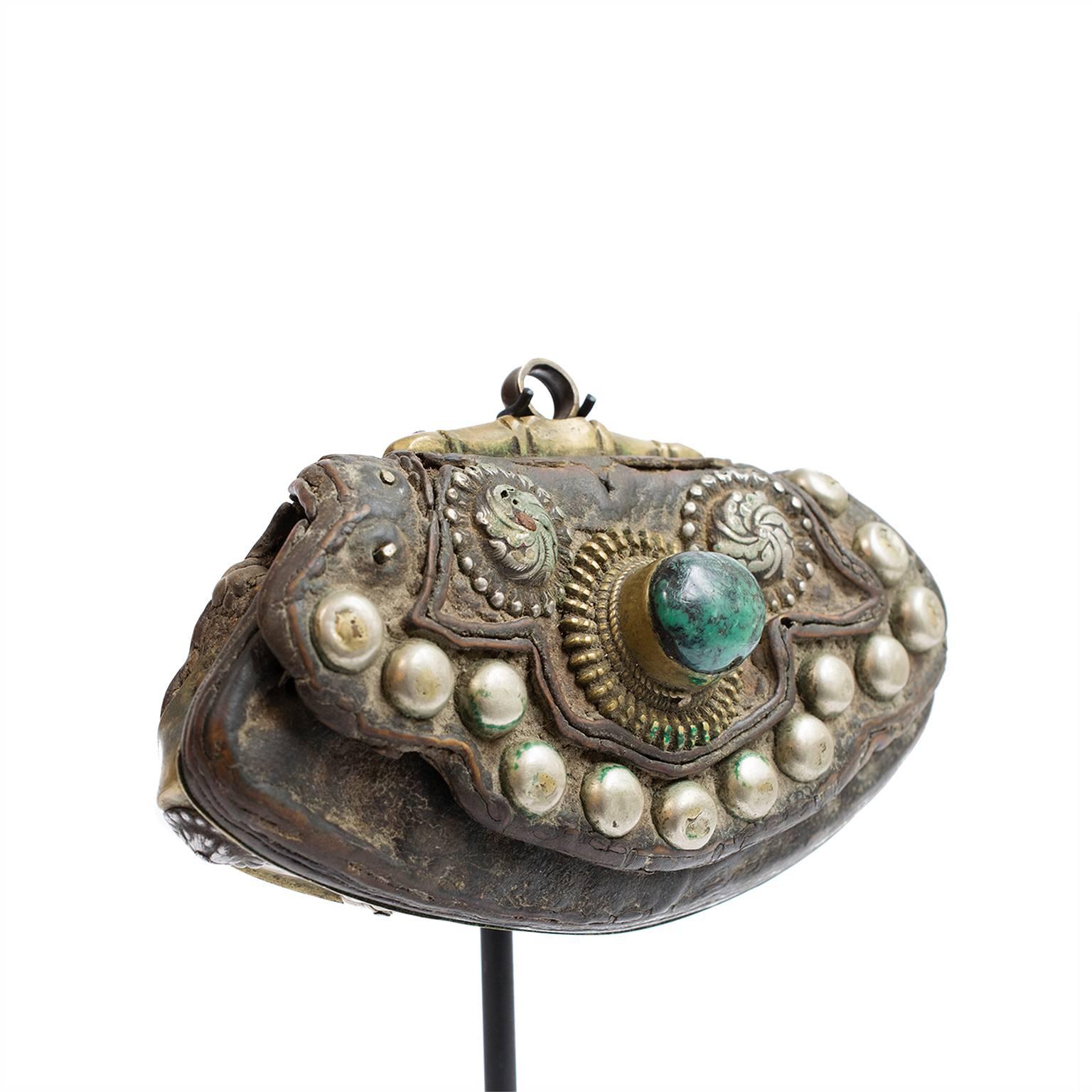 Over a hundred years ago some wealthy man may have used this one-of-a-kind pouch to carry flint. He would have used the stone to start fires while traveling out on the Tibetan plateau. Many flint pouches are utilitarian, but this one is unusually