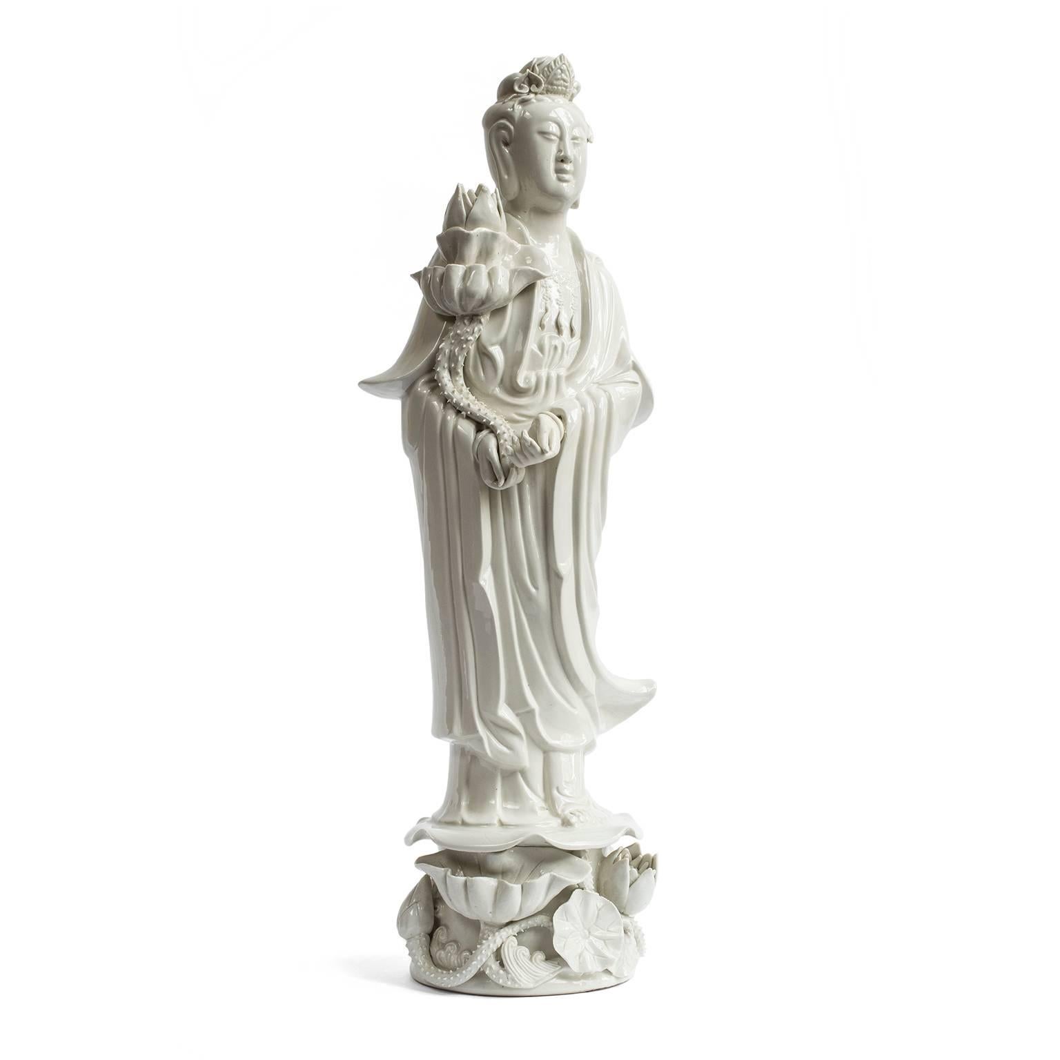 Guan Yin is a bodhisattva who is sometimes called the Goddess of Mercy. This very fine and intricate pair of early 20th C. Blanc de Chine figures of the goddess are in impeccable condition given their age. This type of
porcelain is made from