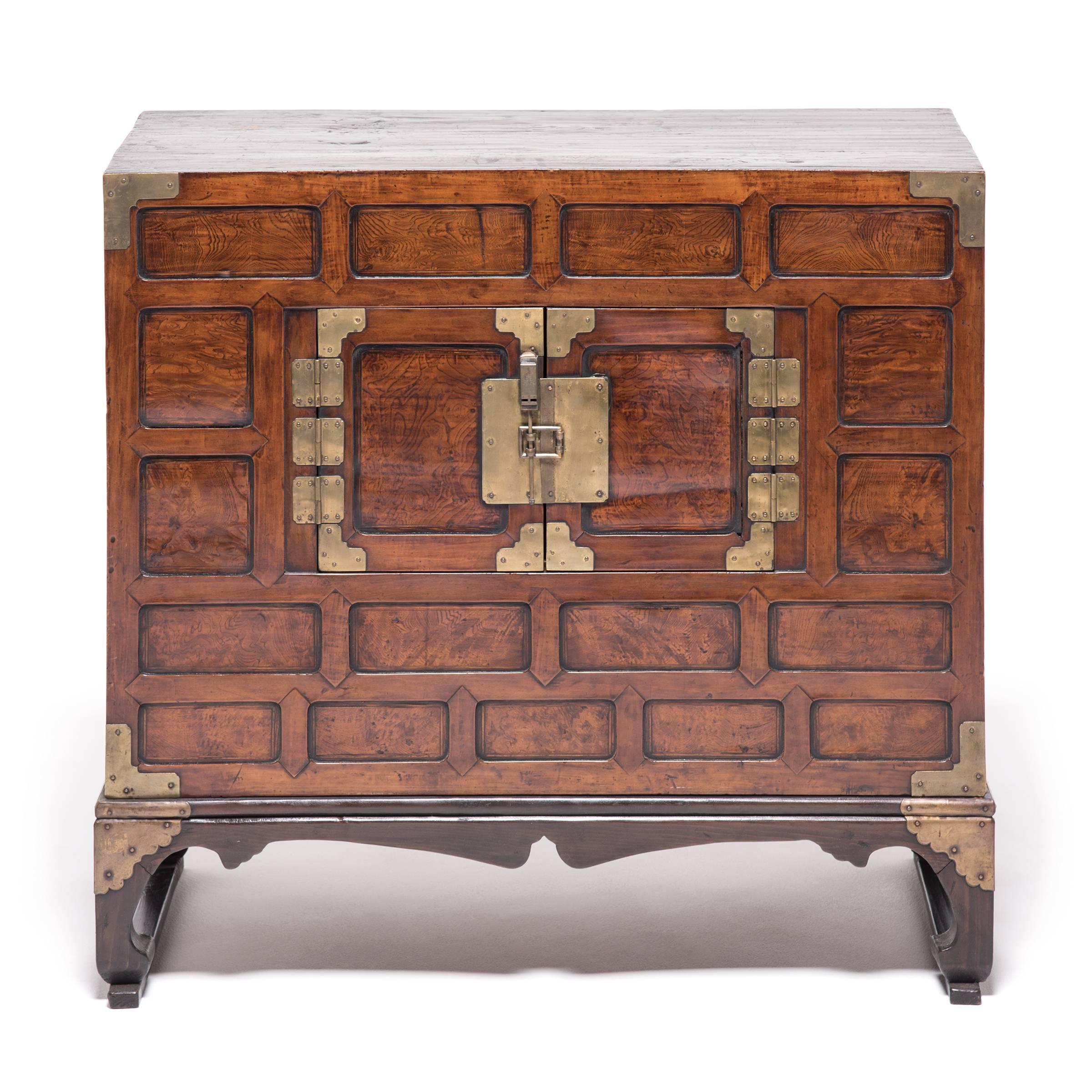 Four types of wood are showcased in this pair of exquisitely crafted Korean chests that date from, circa 1870. United with a coffered design, the cabinets combine paulownia, favoured for its warp-resistant properties; persimmon, for its streaks of