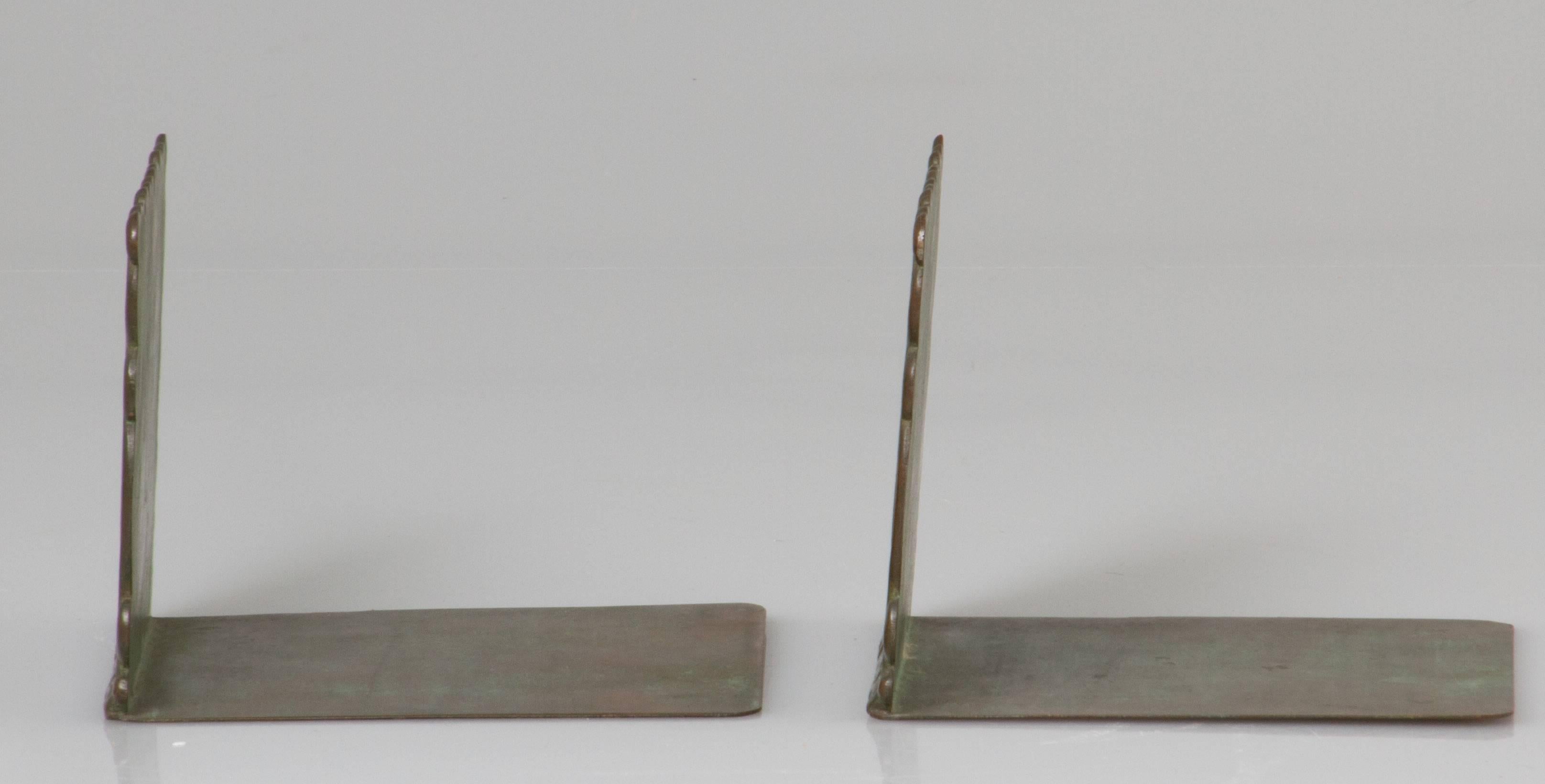 These are a textural and abstract pair of bookends from when Marshall Fields had their own in house studio. Made of copper, they have their wonderful original patina.
