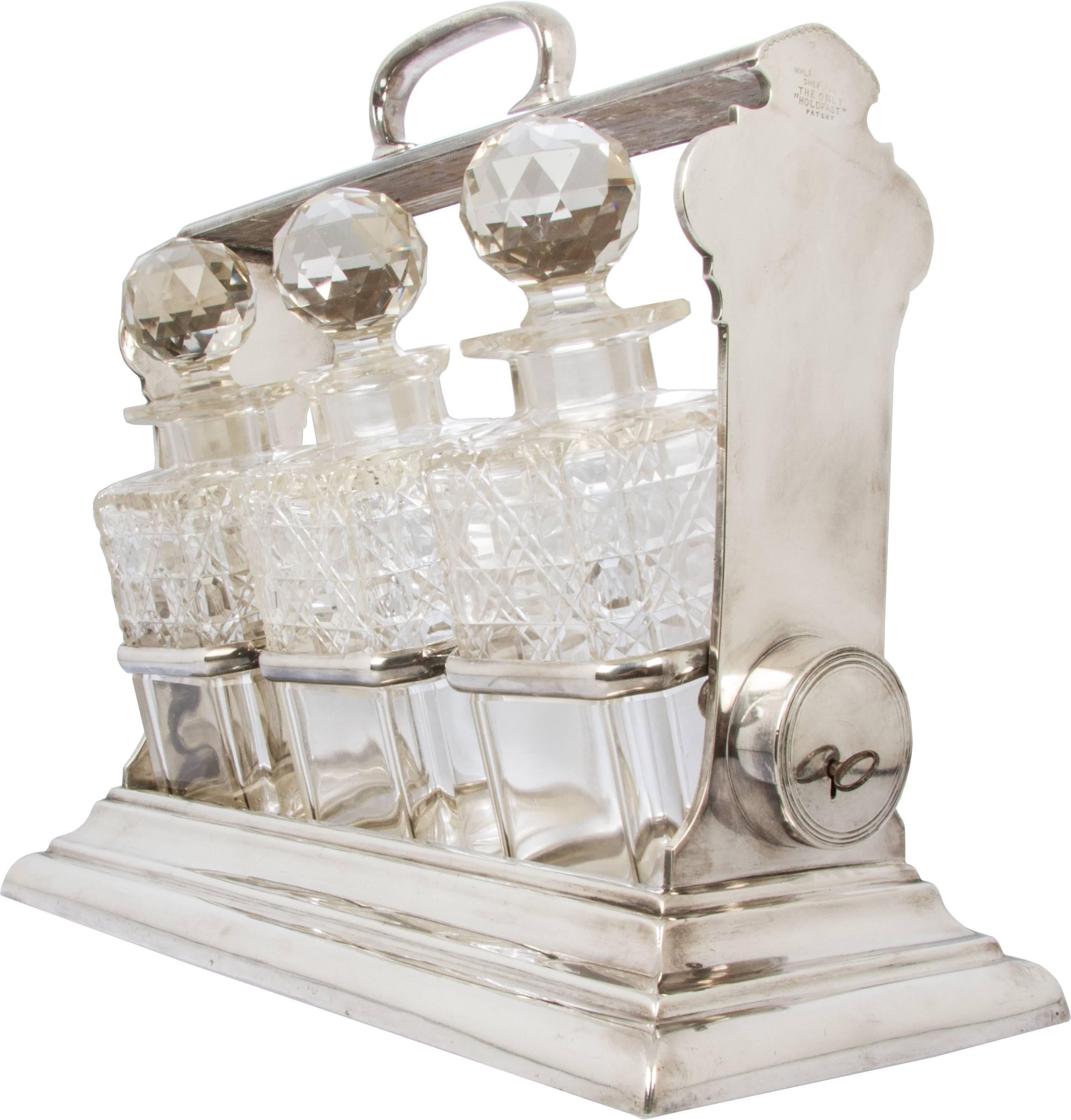 This is a handsome Sheffield silver plate tantalus. Each decanter is marked 1, 2, and 3 which corresponds to marked brackets on the Tantalus. It has a simple design which is quite appealing.

