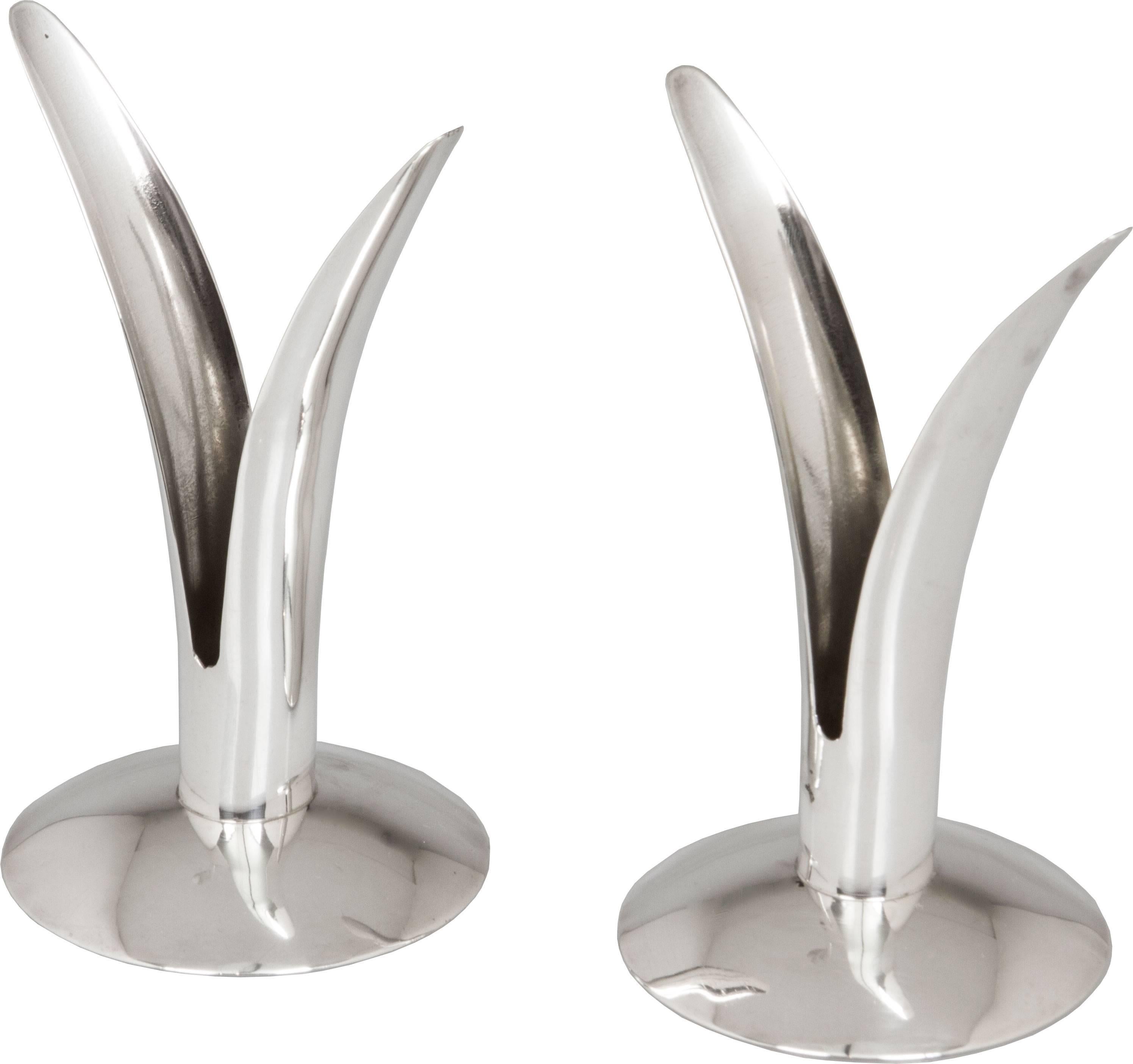 These are interesting sterling silver candlesticks by the American firm Sciarrotta, based out of Newport Rhode Island.