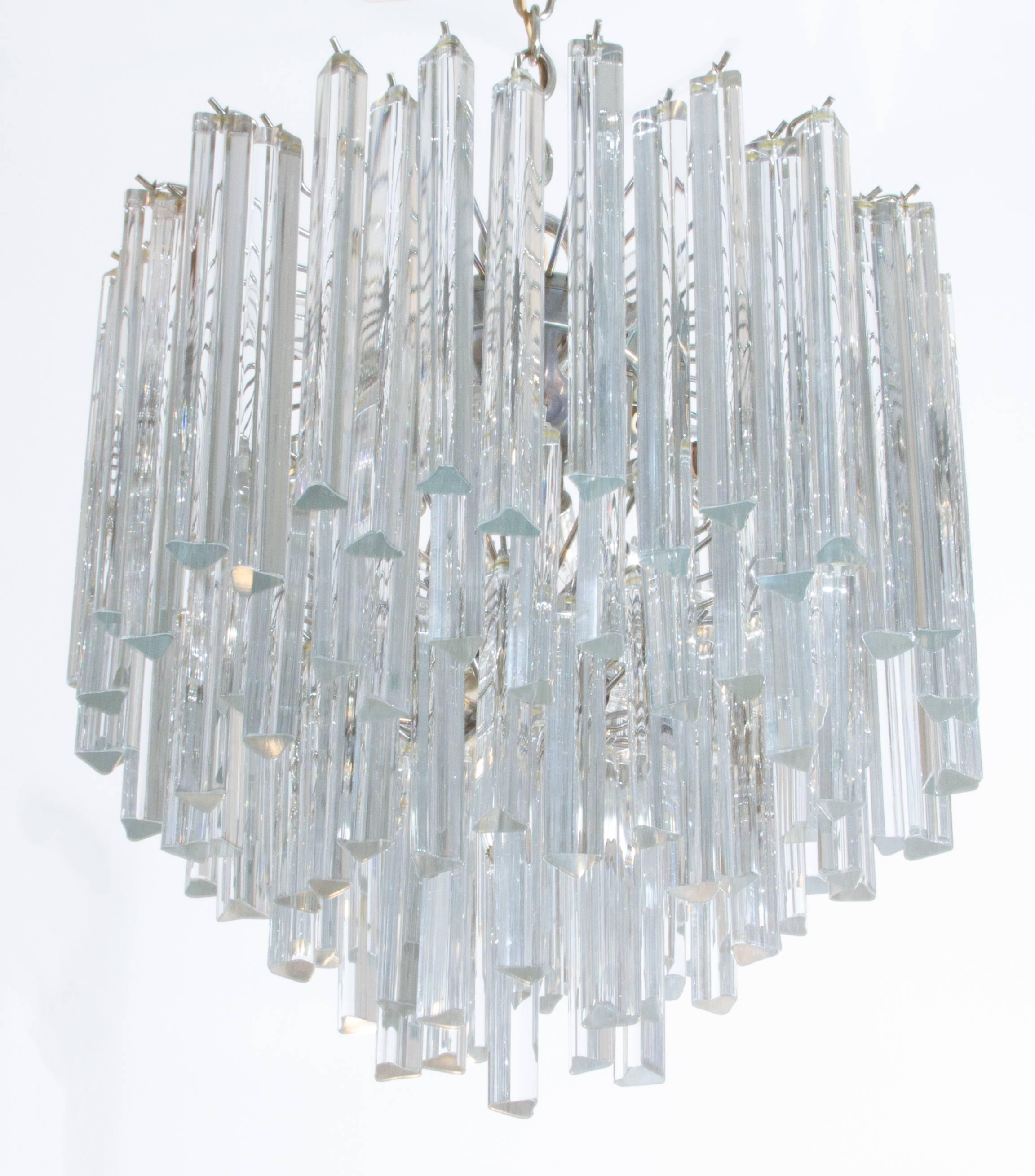 This is a very nice looking multi layered chandelier with a chrome armature.