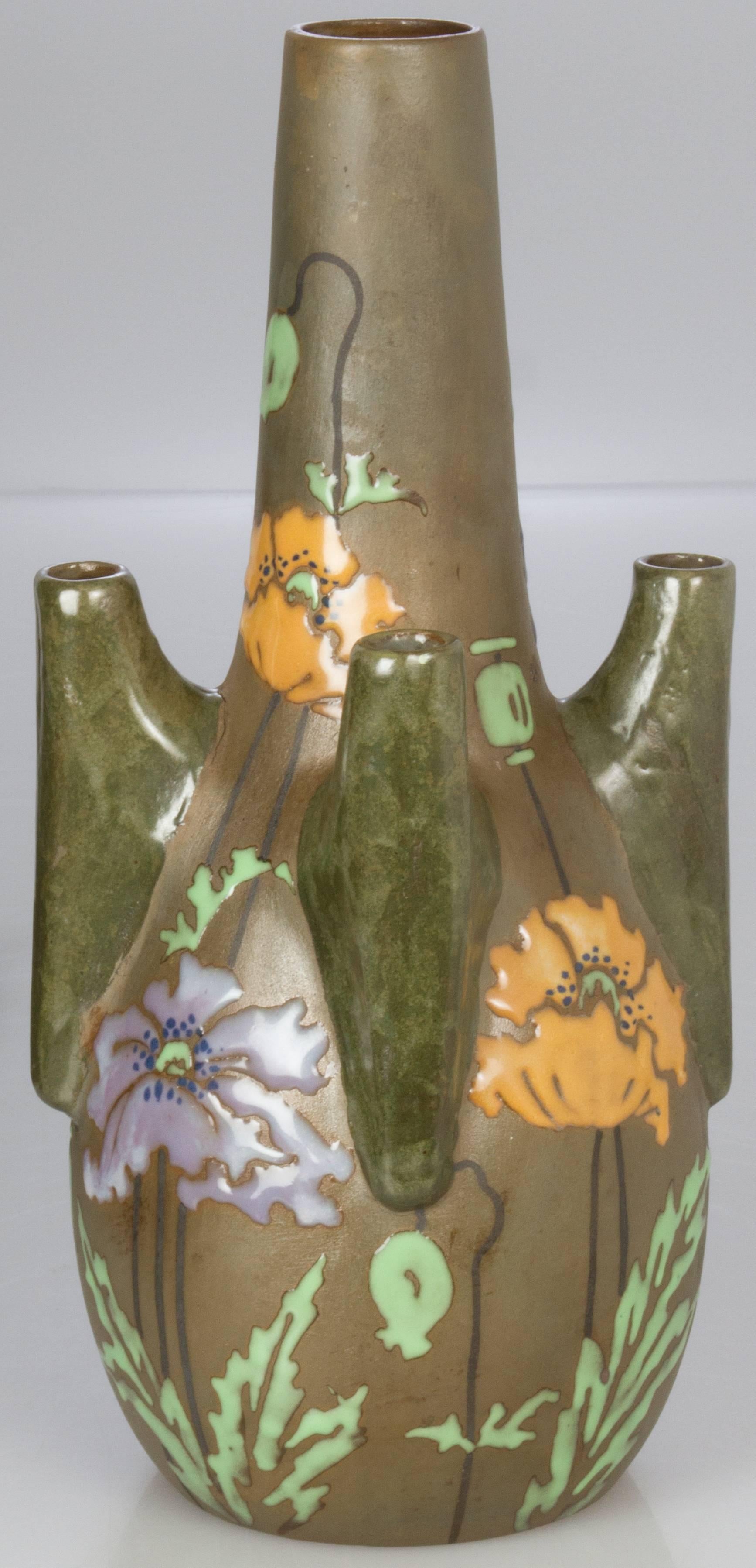 This is an unusually shaped vase with beautifully painted poppies, having four vaselets.