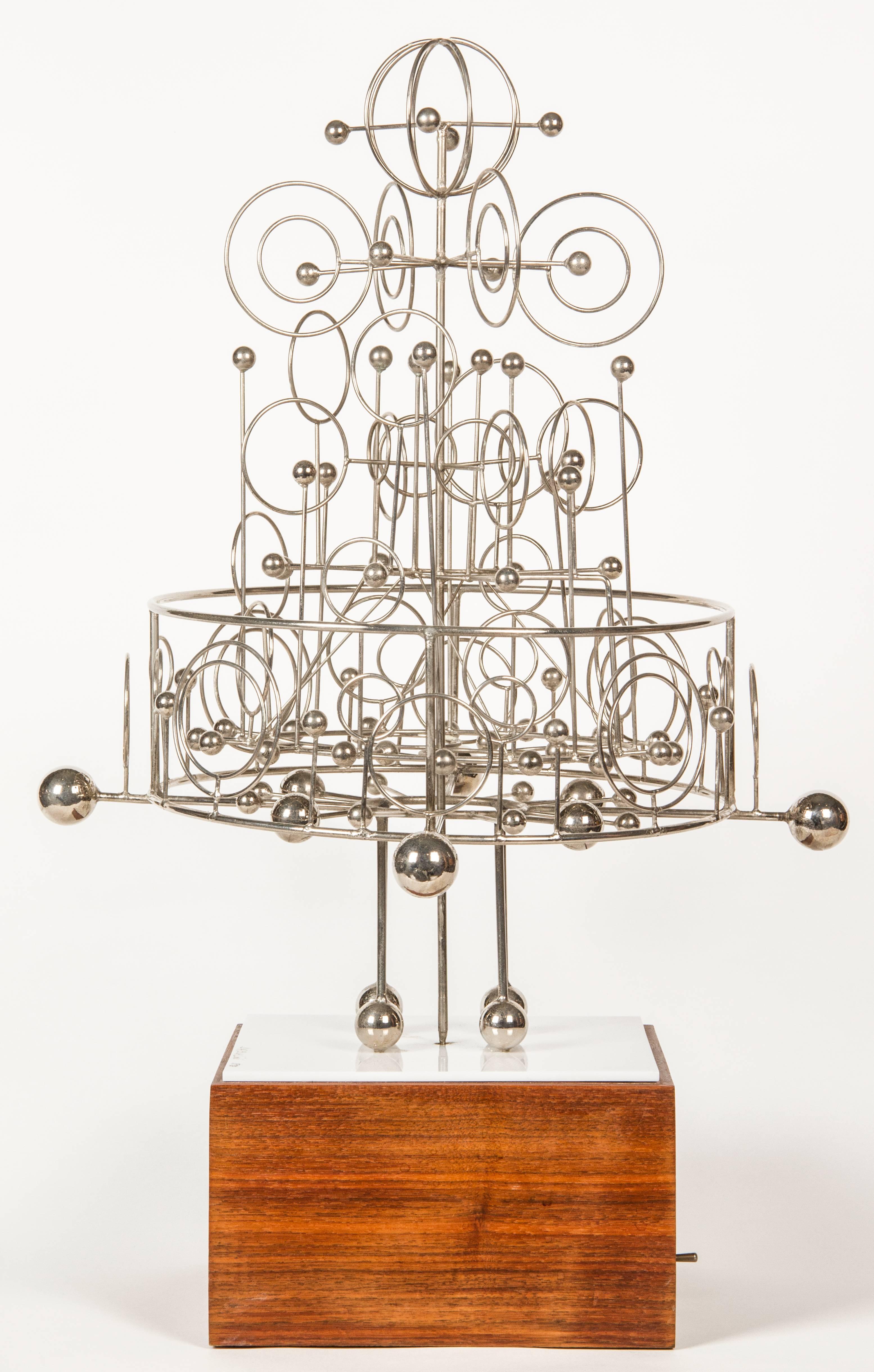 This is a wonderfully designed kinetic sctulpture by Chicago's Joseph Burlini. The sculpture is battery powered.