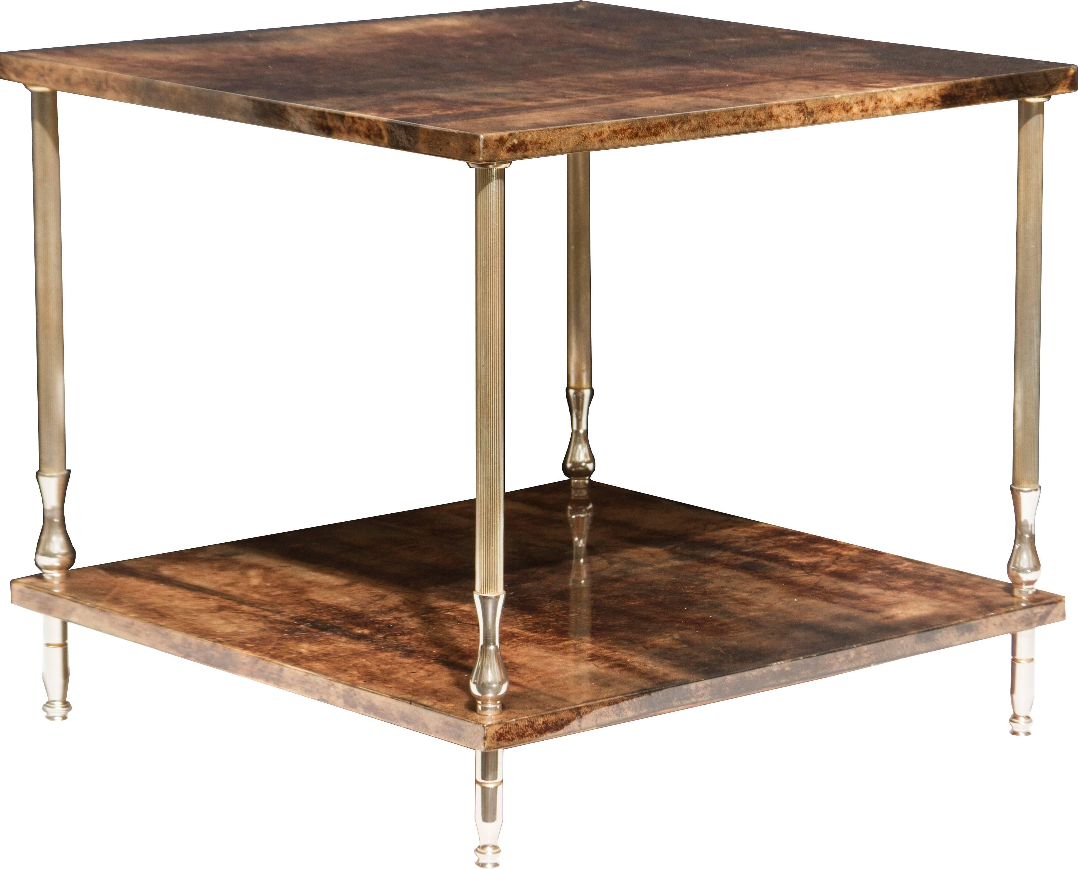 This is a handsome table with elegant brass legs.