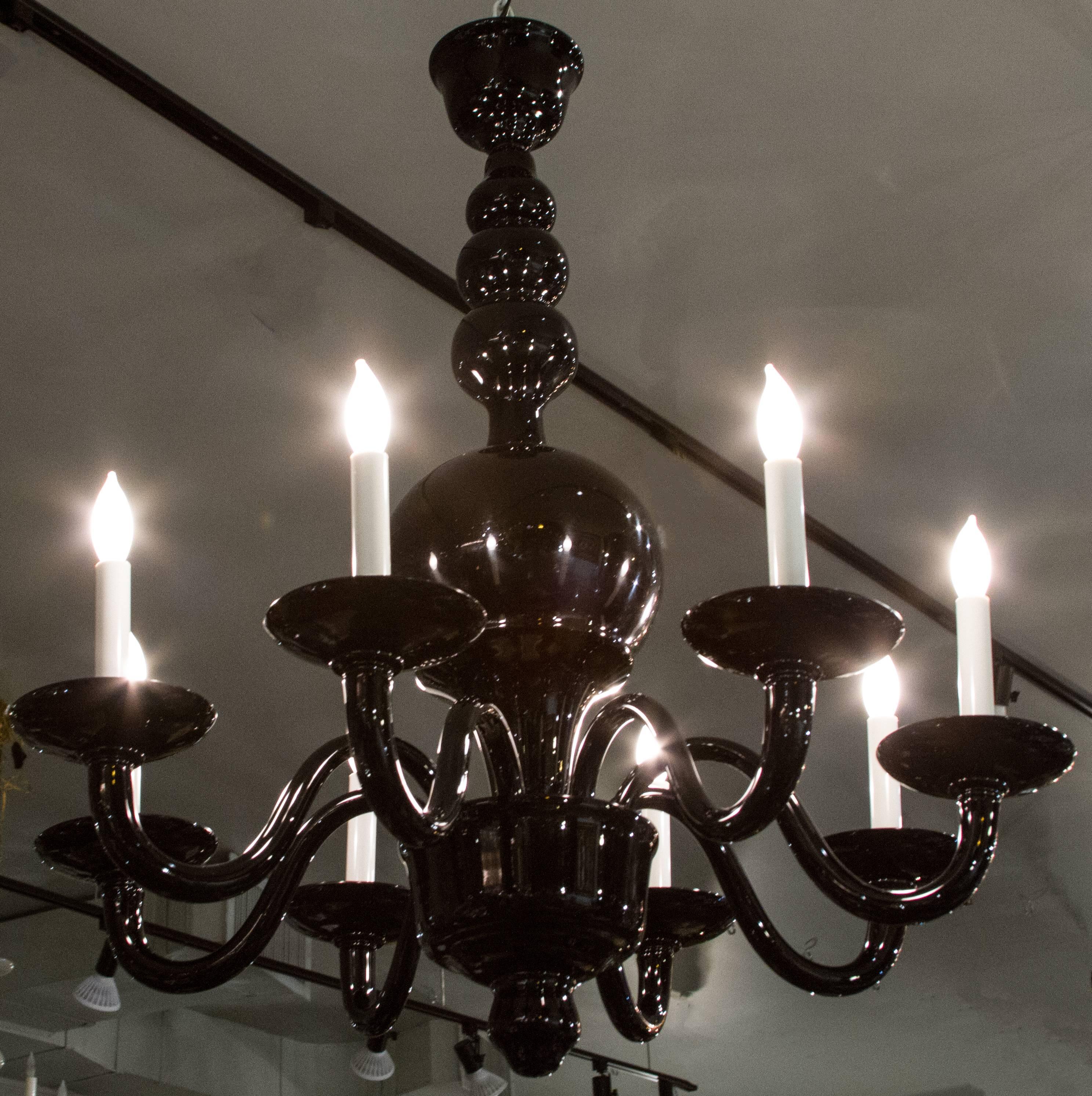 This is a handsome, clean lined eight armed chandelier.
