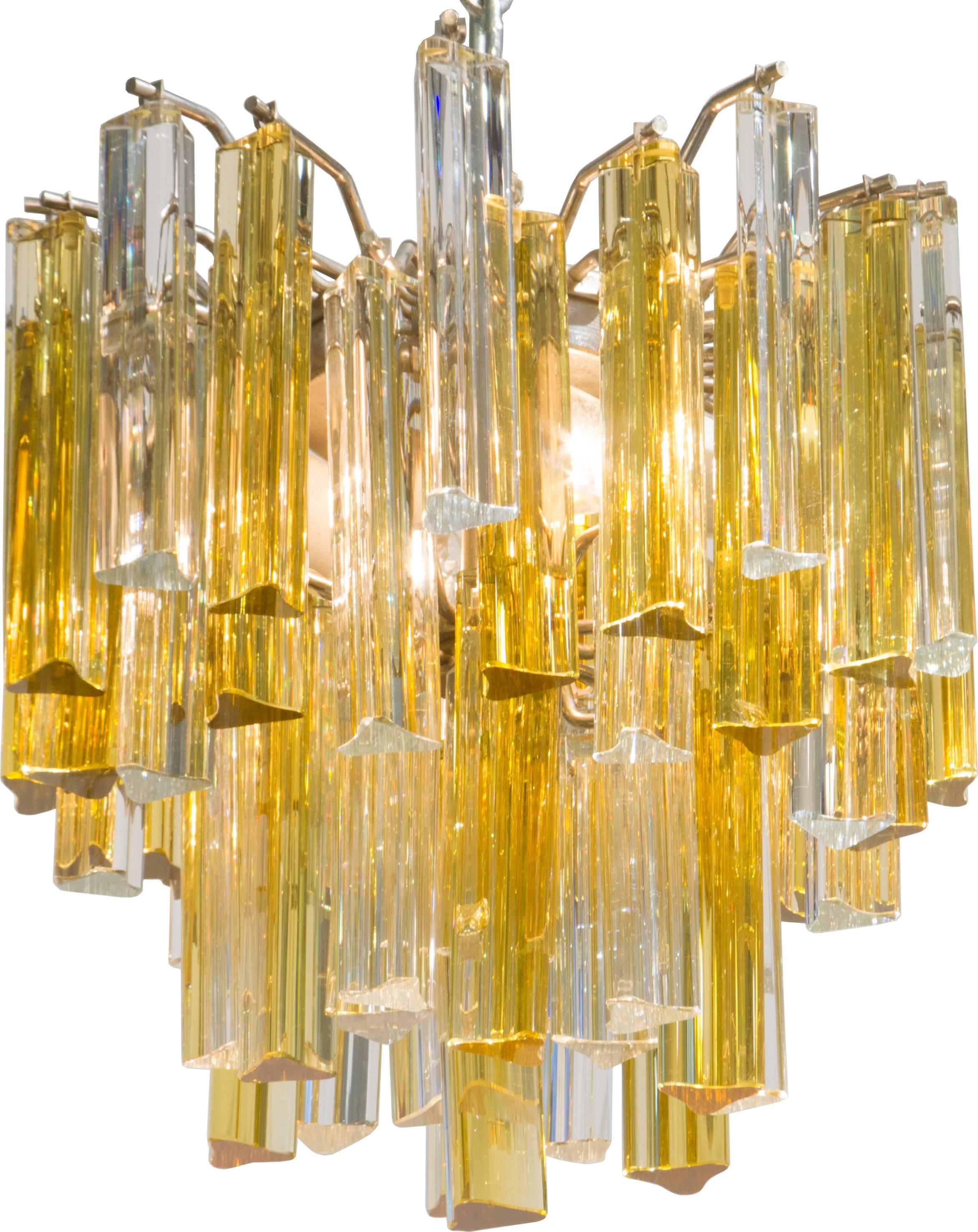 This is an interesting Camer fixture accented with rare yellow colored prisms.