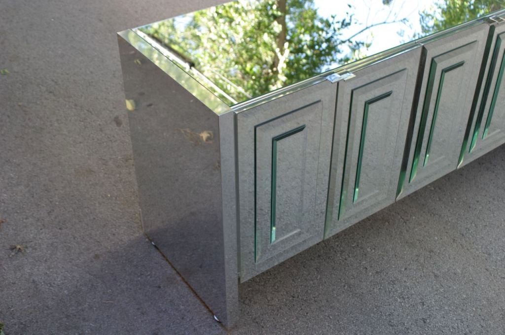 Hollywood Regency Ello mirrored doors and top credenza with concentric beveled glass rectangles on doors with chrome pulls, Chrome clad sides. I also have two 5 ft version available. Nice Condition. 