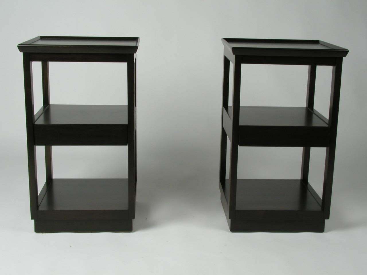 Pair of Edward Wormley for Drexel three-tiered nightstands with center drawer, from his Precedent Collection, c.1950s. Silver Elm is refinished in a dark espresso finish. 