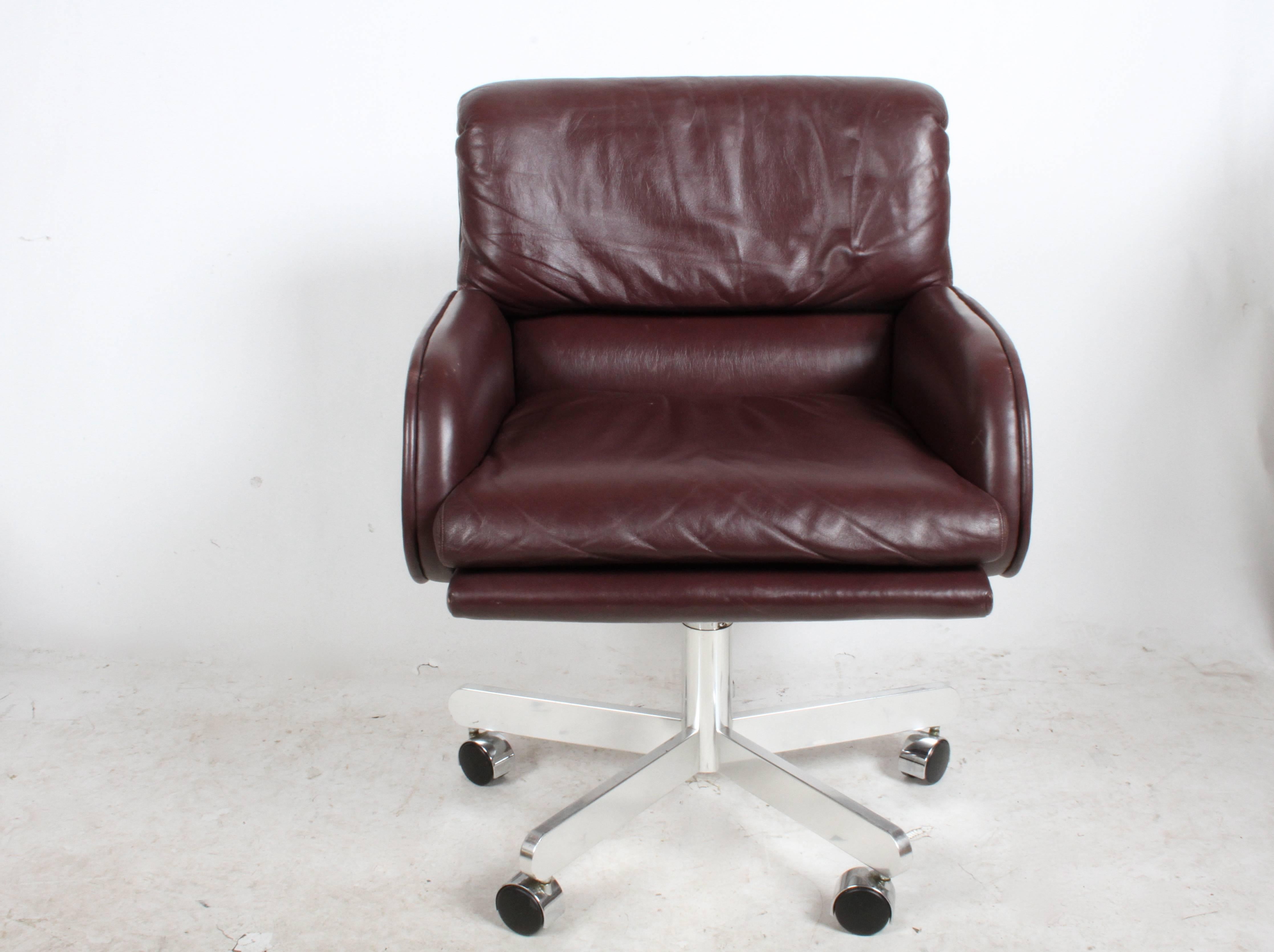 Set of six plush office, desk or conference armchairs designed by Roger Sprunger for Dunbar, D labels, chairs in dark eggplant leather with 5 star solid aluminum bases, adjustable seat height and tilt function. 

Note leather has some scruffs and