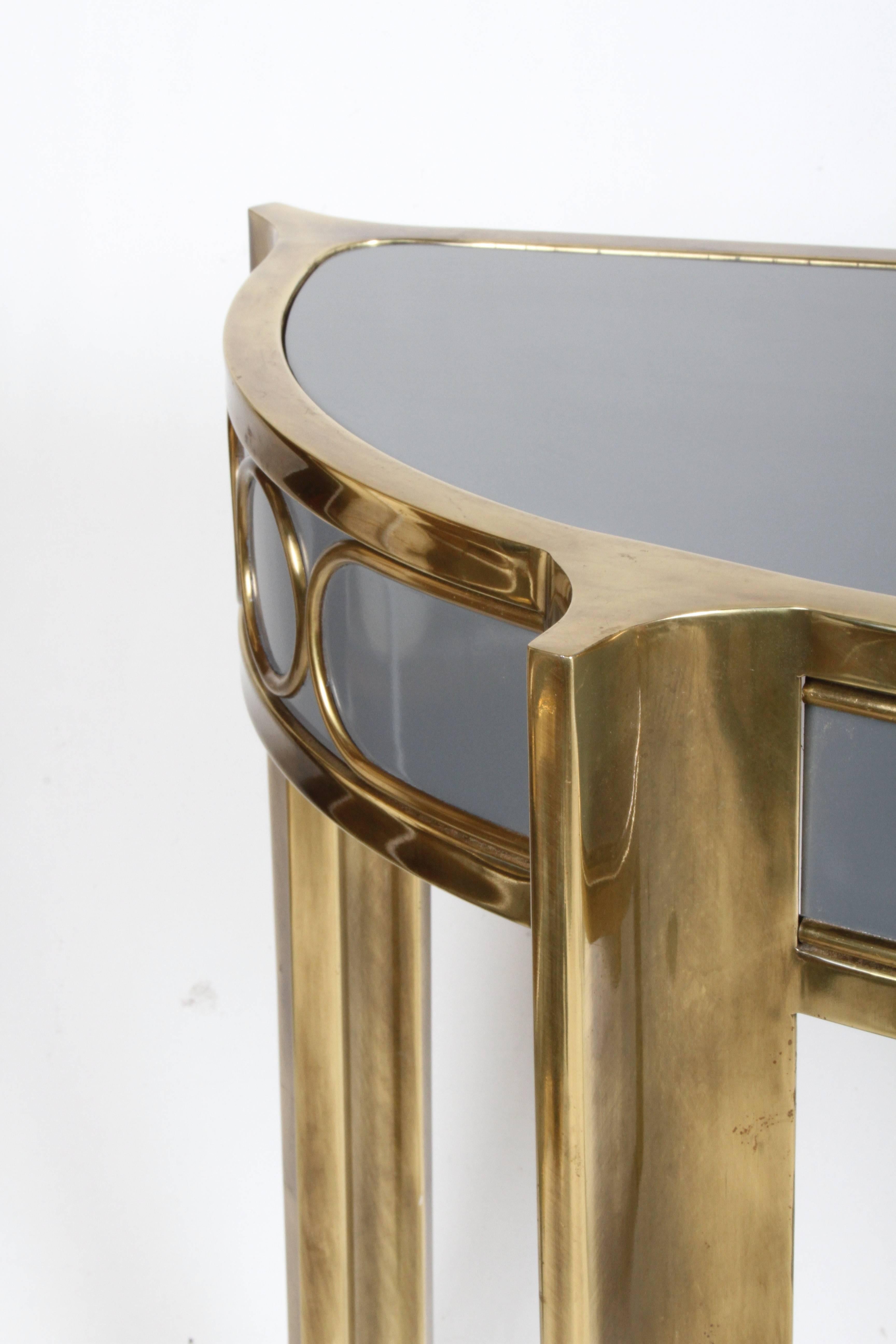 Mastercraft demilune brass and lacquer console. New grey lacquer, brass has original patina.  Mastercraft Label. 