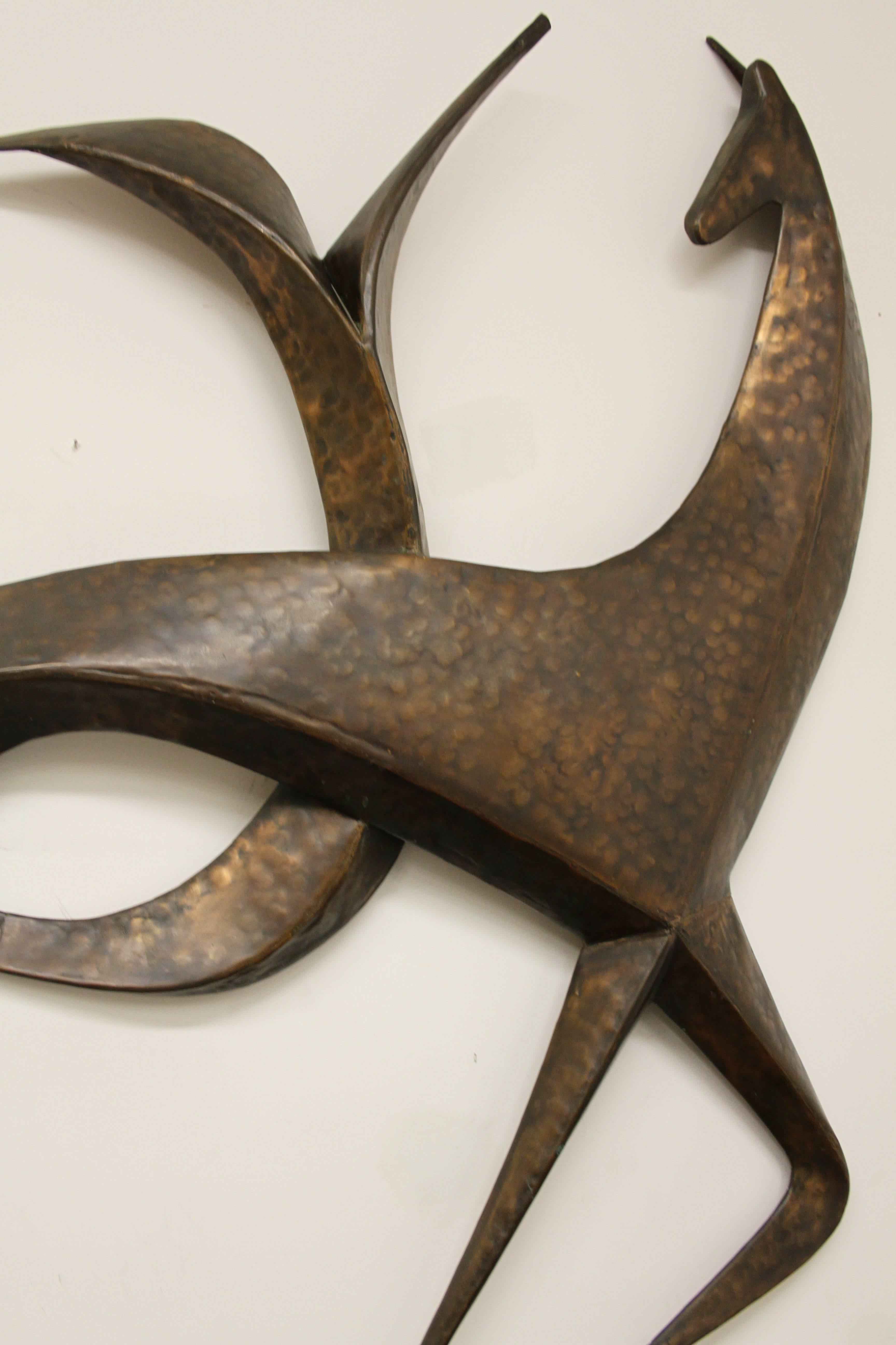 Large hand-wrought copper abstract horse wall sculpture with hammered finish, in the style of Frederick Weinberg, Marino Marini or C. Jere. There are two sets of wires on the back frame to hang on wall. Very nice condition, minor patina. Possible