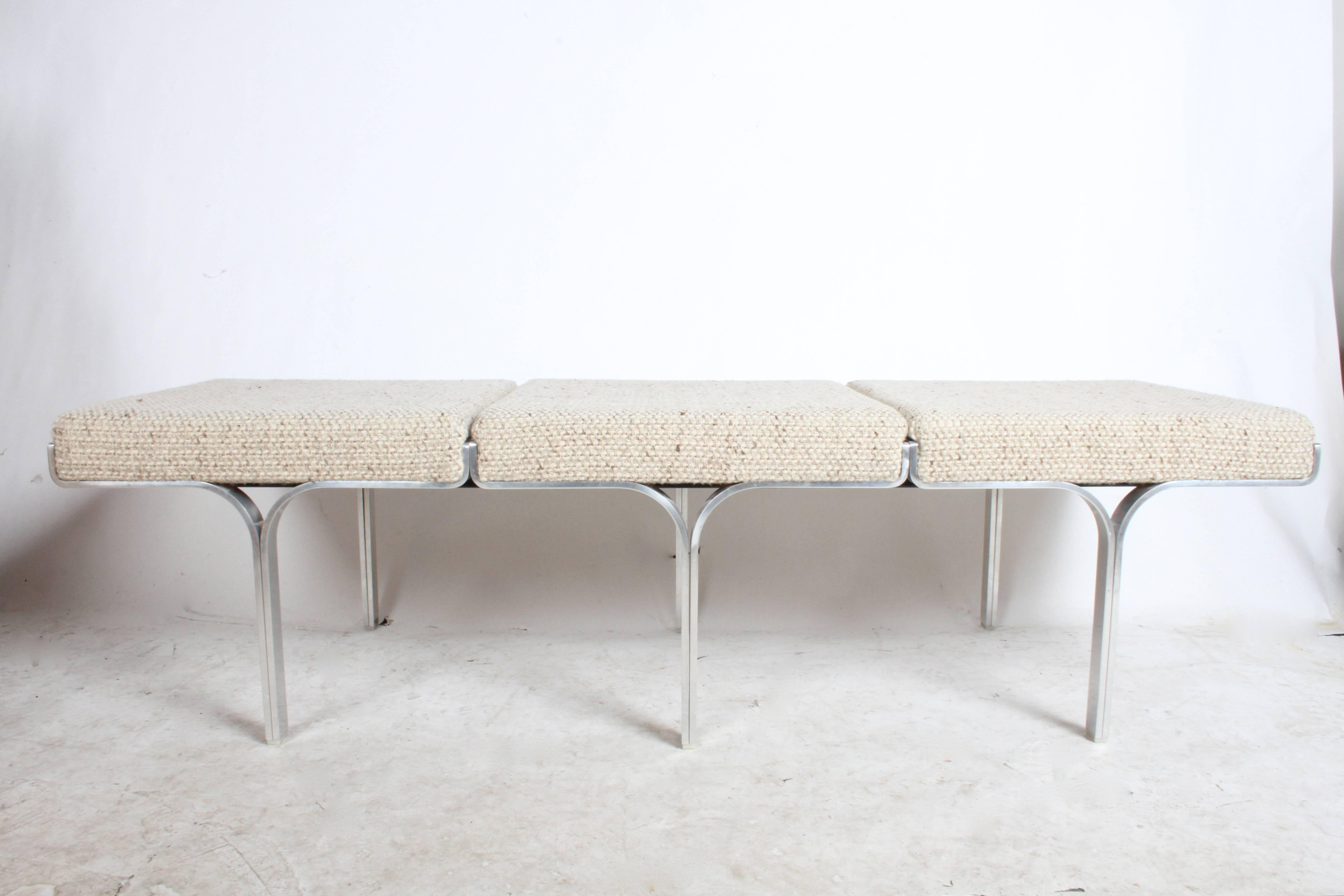 John Behringer model 656 link triple aluminum bench. This bench is in MOMA's permanent collection. Manufactured by J.G. Furniture Co, circa 1961. Oatmeal colored upholstery is clean and foam in good.