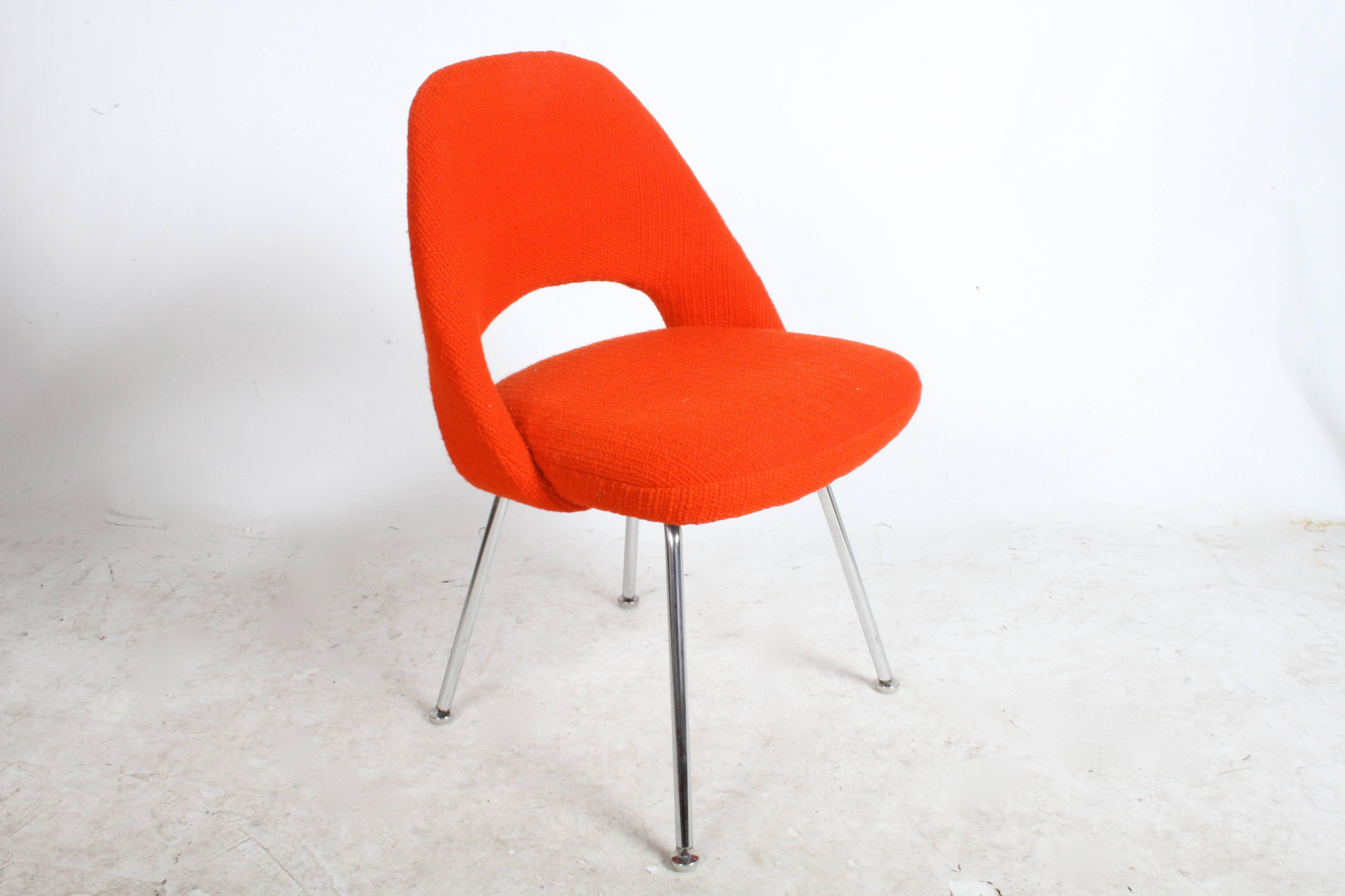 Set of six Eero Saarinen executive side or dining chairs with chrome legs and original Knoll red tweed fabric. Fabric has stains on all six chairs and maybe can be professionally cleaned and foam is firm so should be replaced. Chrome is very nice,