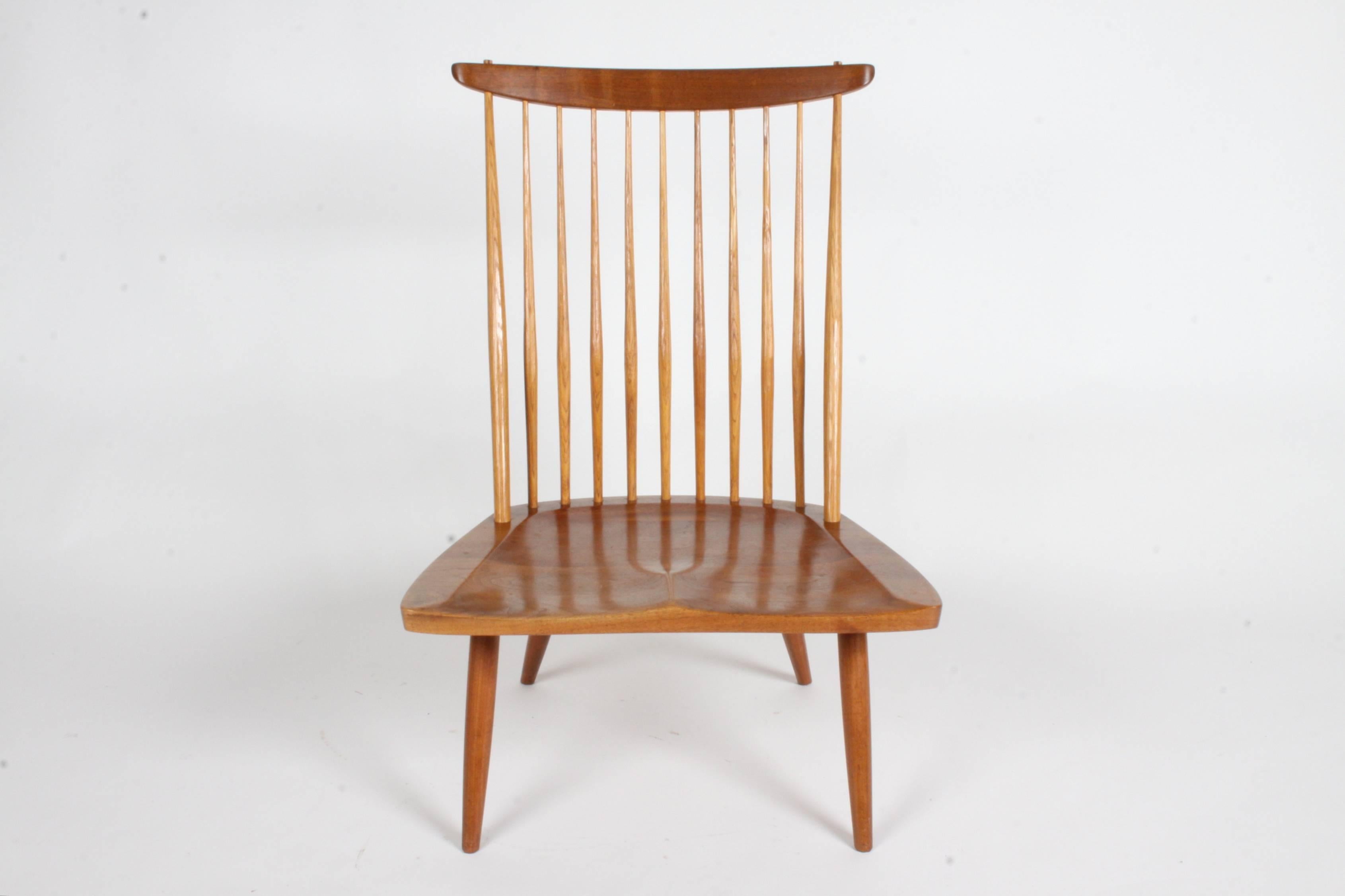 George Nakashima New Lounge Chair - Studio production c. 1978 for St. Louis Architect Phillip Cotton in beautiful walnut with great patina. This chair comes with the original documents and receipt from the Nakashima Studio. Bottom of chairs is