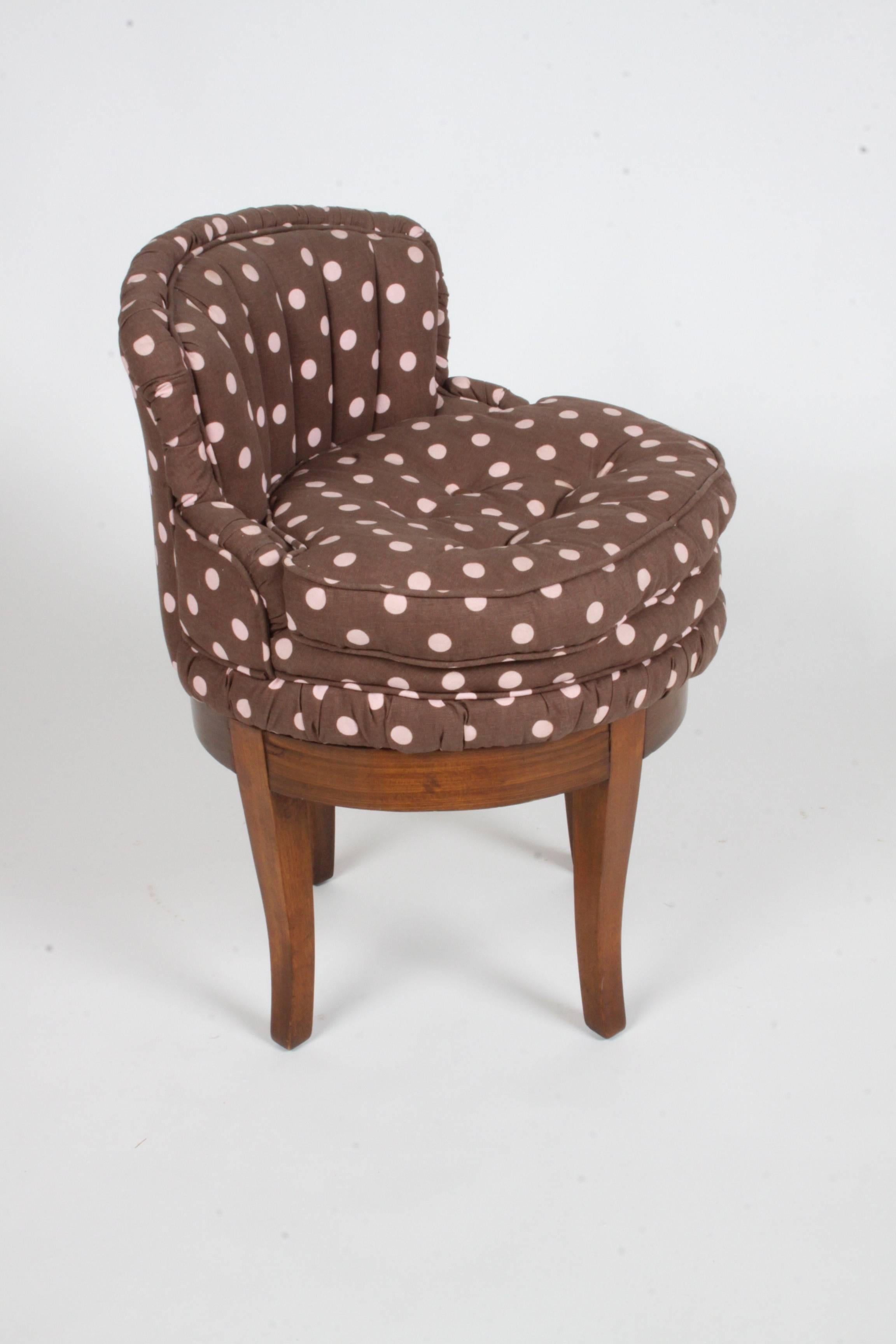 Vintage 1940s Swivel Vanity stool, with tufted polka dot fabric. Legs to be touched up prior to shipping. Fabric is clean, but may want to update. 
Seat depth 15.5