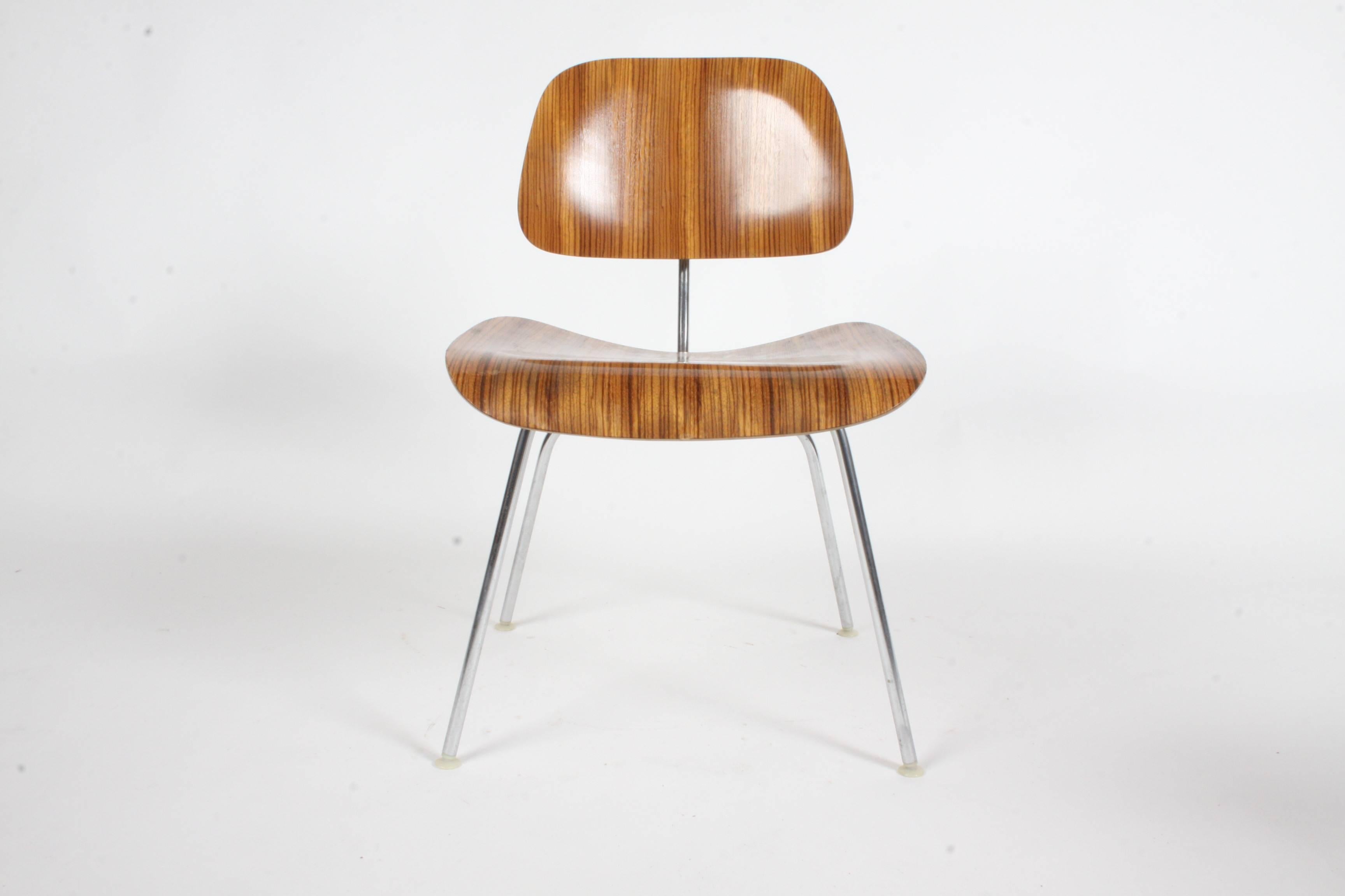 Pair of Charles Eames for Herman Miller Zebrawood DCM chairs - rare set. Zebrawood was used from 1954-1959. Very nice original condition, minor scuffs. Labels.