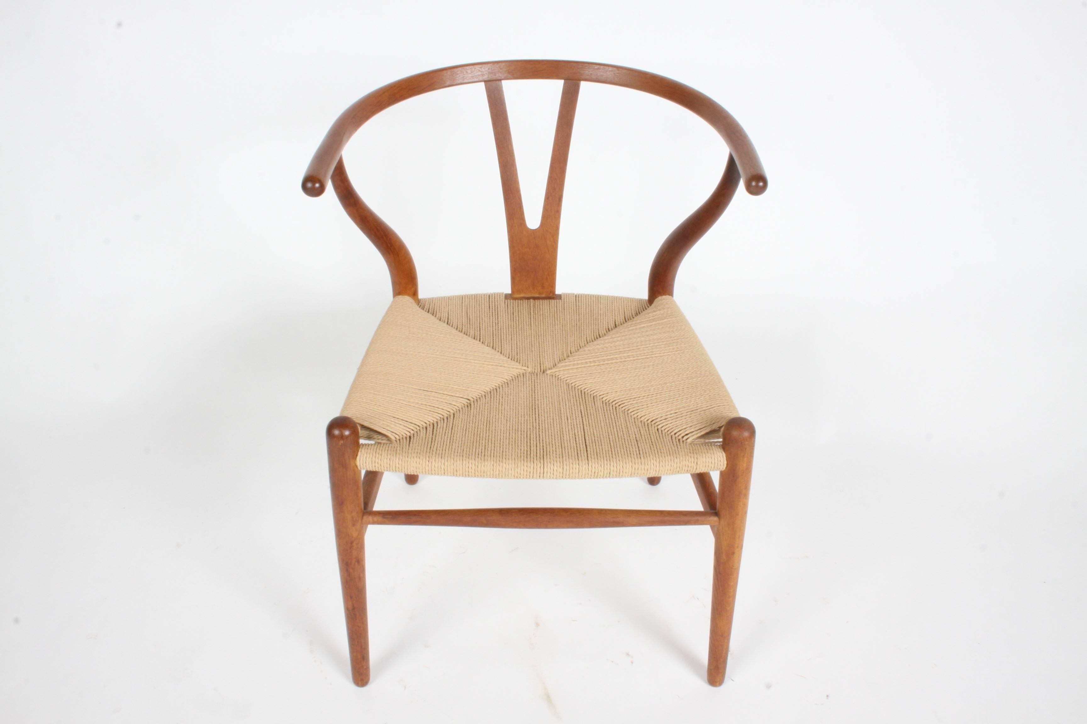 Hans Wegner set of six Wishbone CH-24 dining chairs for Carl Hansen from one owner estate. Chair are to be re-corded, re-glued and original finish restored. Only one chair from the set of six has been restored so far, images shown. Over all very