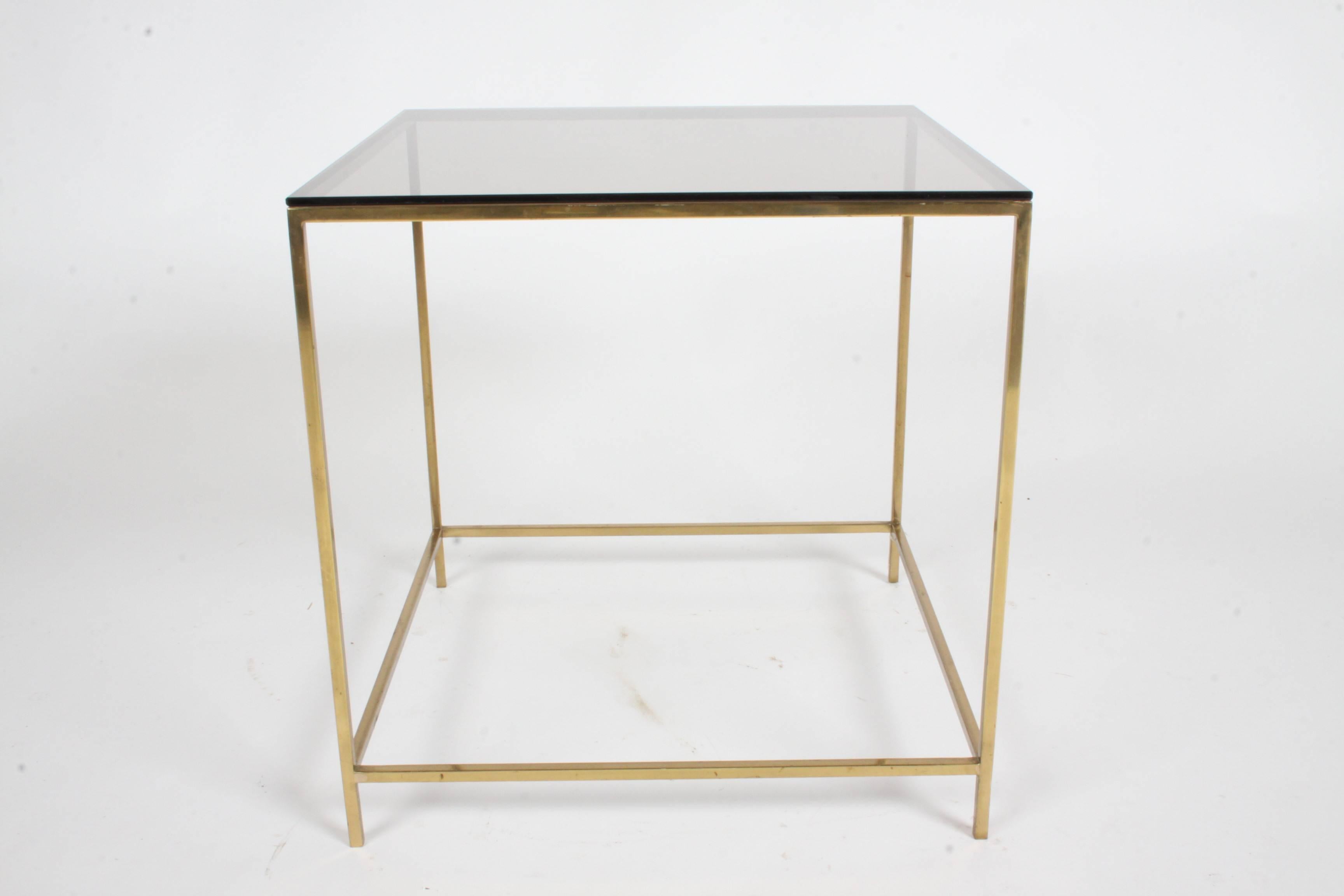 Mid-Century Modern brass and bronze glass side table, circa 1970s. Very much in the style of Paul McCobb or Milo Baughman designed pieces. Minor scratches to bronze colored glass, brass has light scuffs. Very nice example.