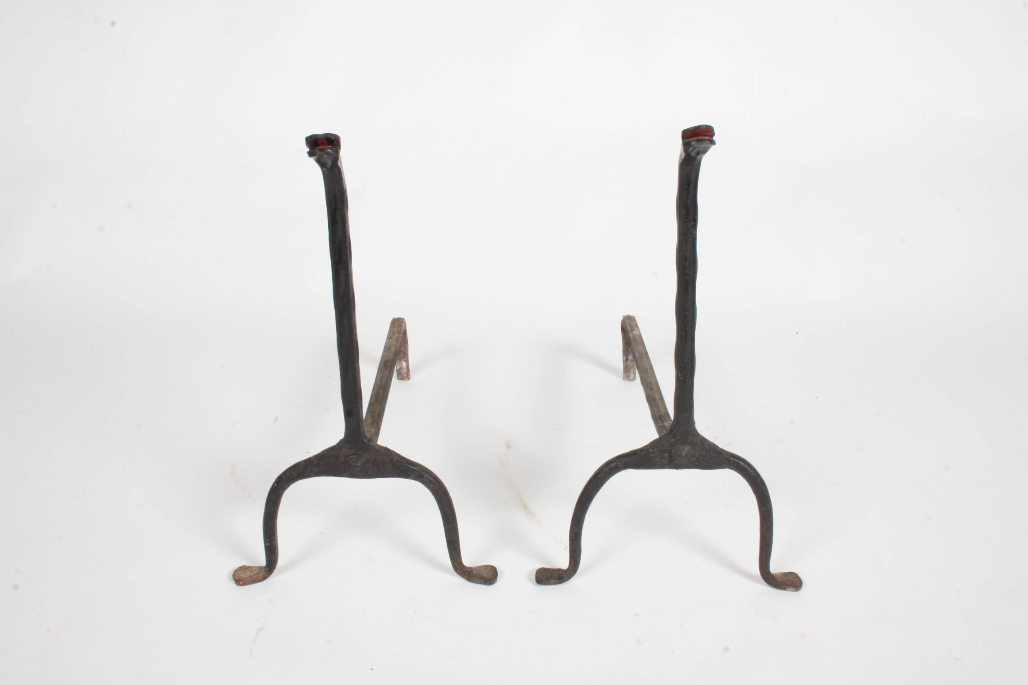 Vintage pair of hand-wrought black iron snake form andirons.